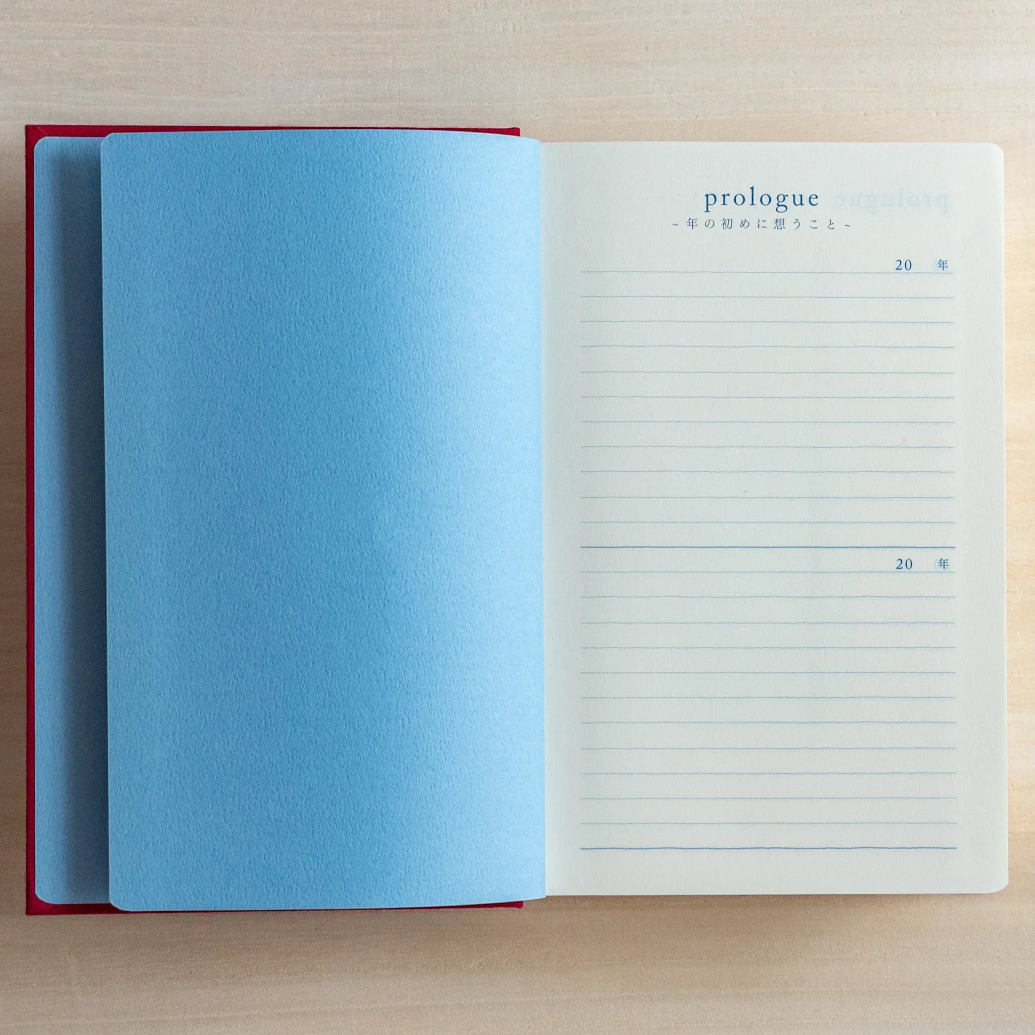 Midori 10-year journal, flat lay composition showing cover and spine detail, Japanese stationery product with quality design