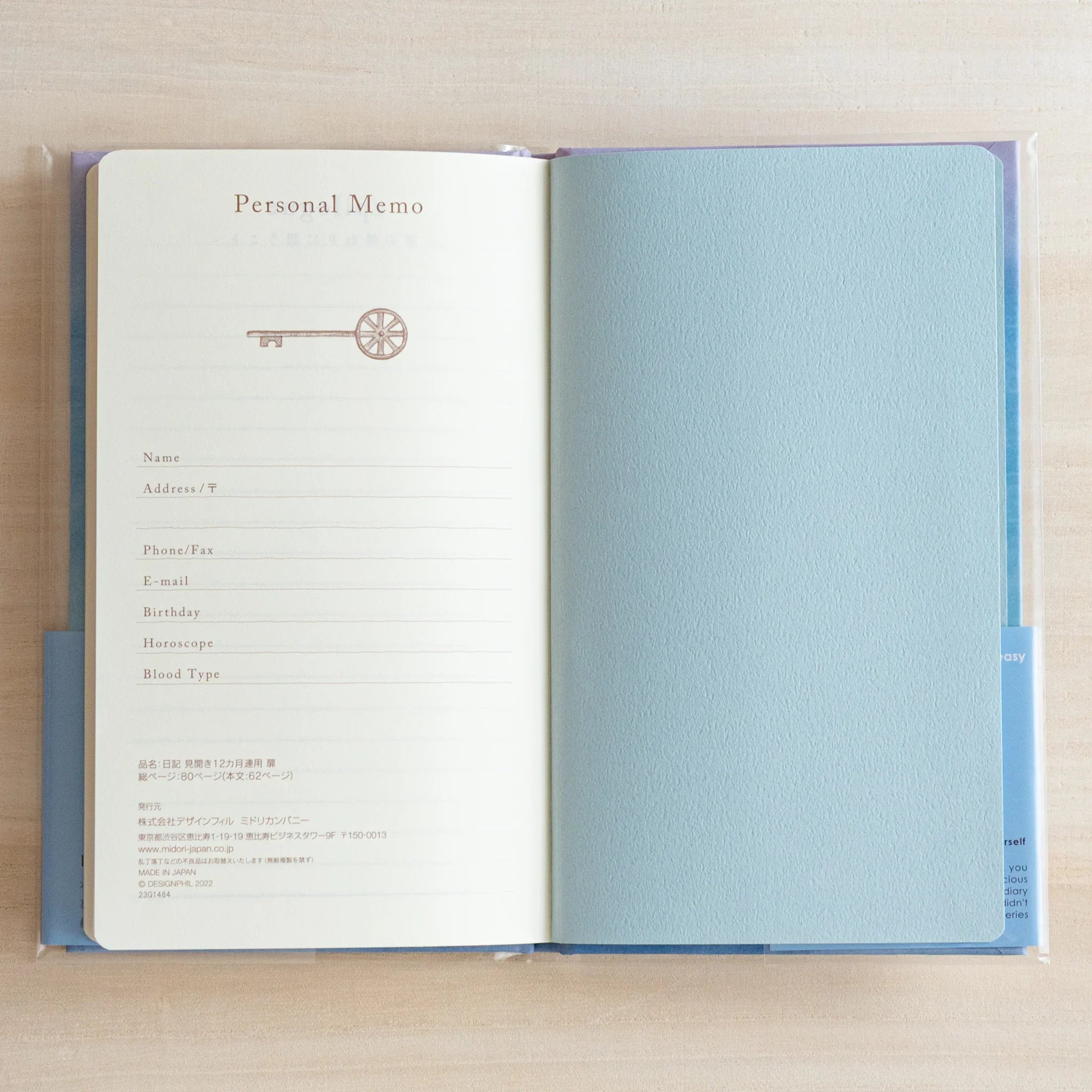 Open diary showing interior pages with gate motif design and comprehensive date organization system visible