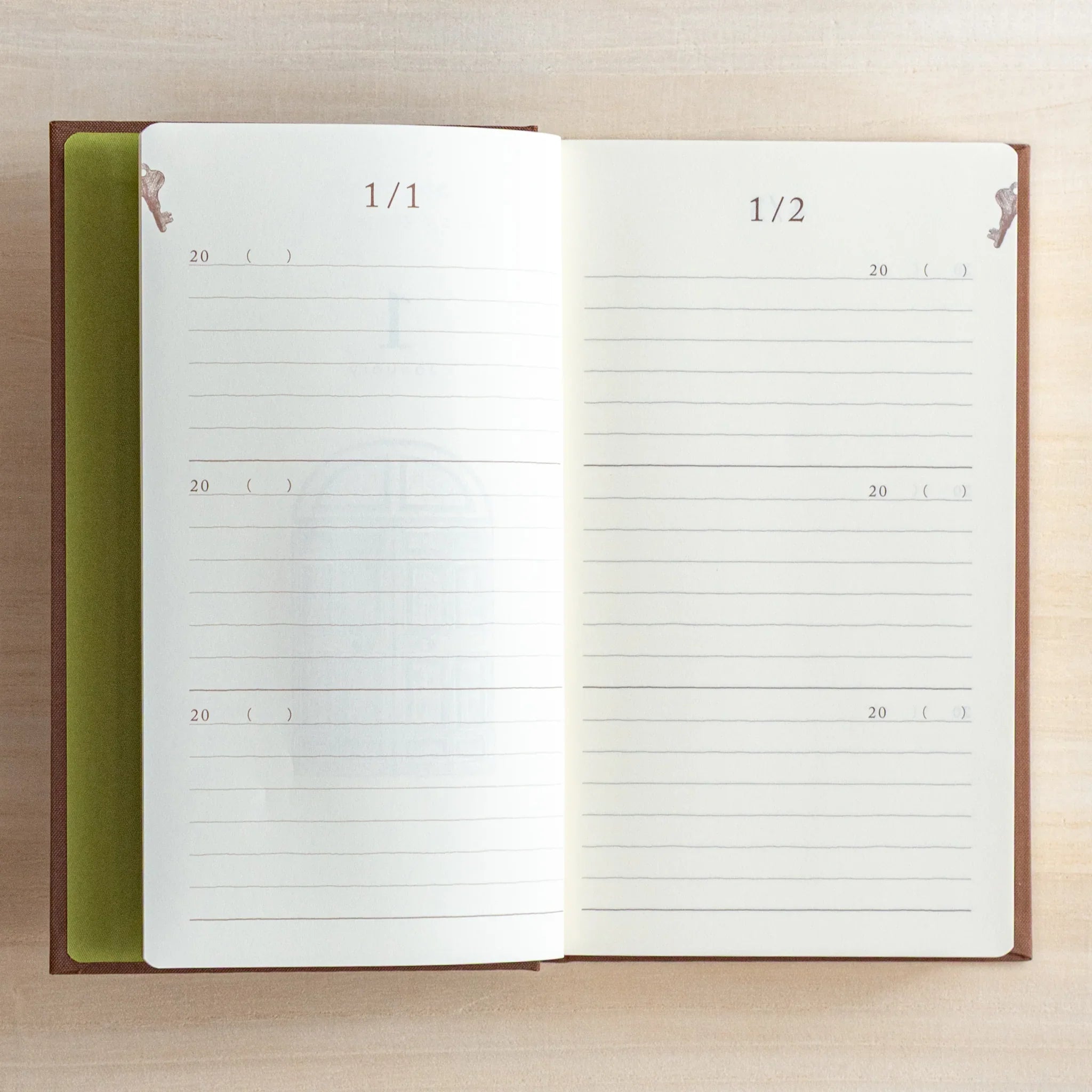 Midori 3-year journal, opened view showing paper color and opacity, Midori 3-year journal with embossed cover for long-term