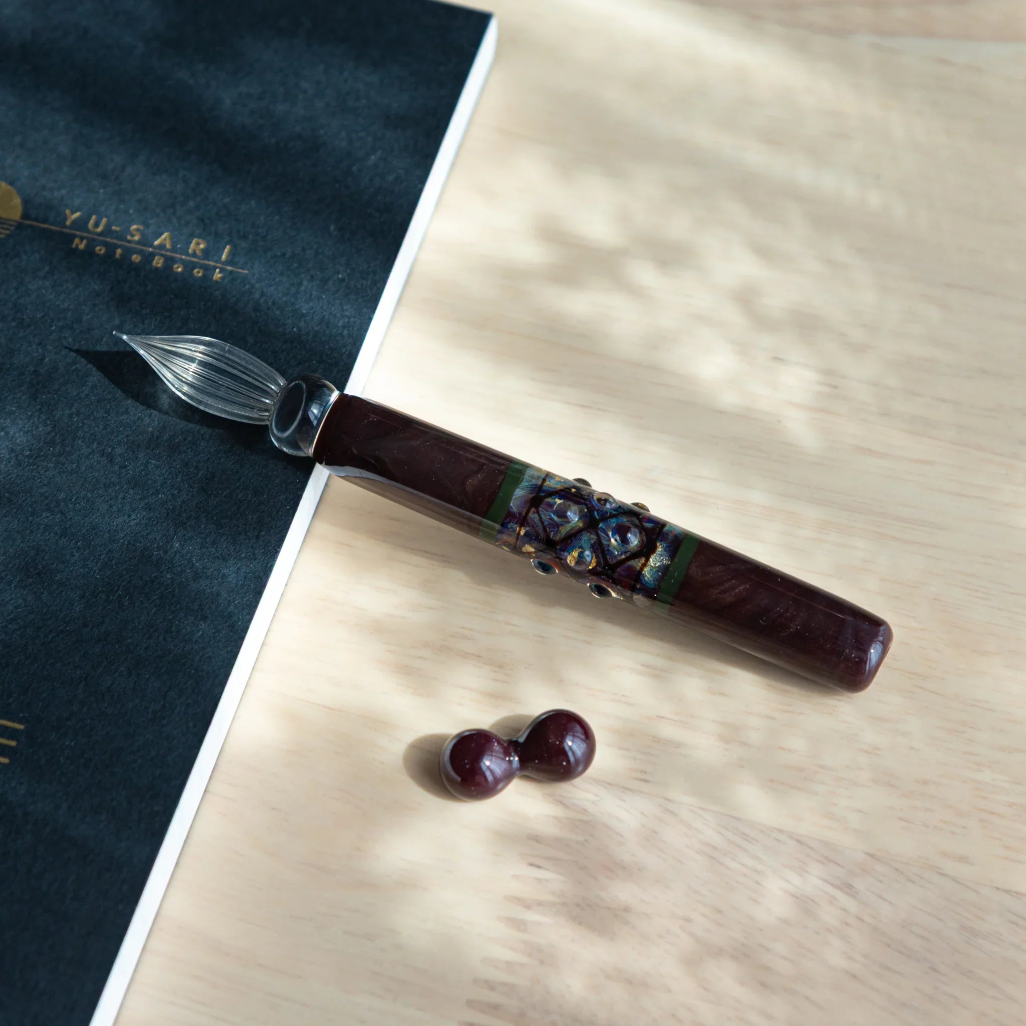 Dark wooden glass dip pen with reflective mirror sphere glass ornament and matching wooden pen rests