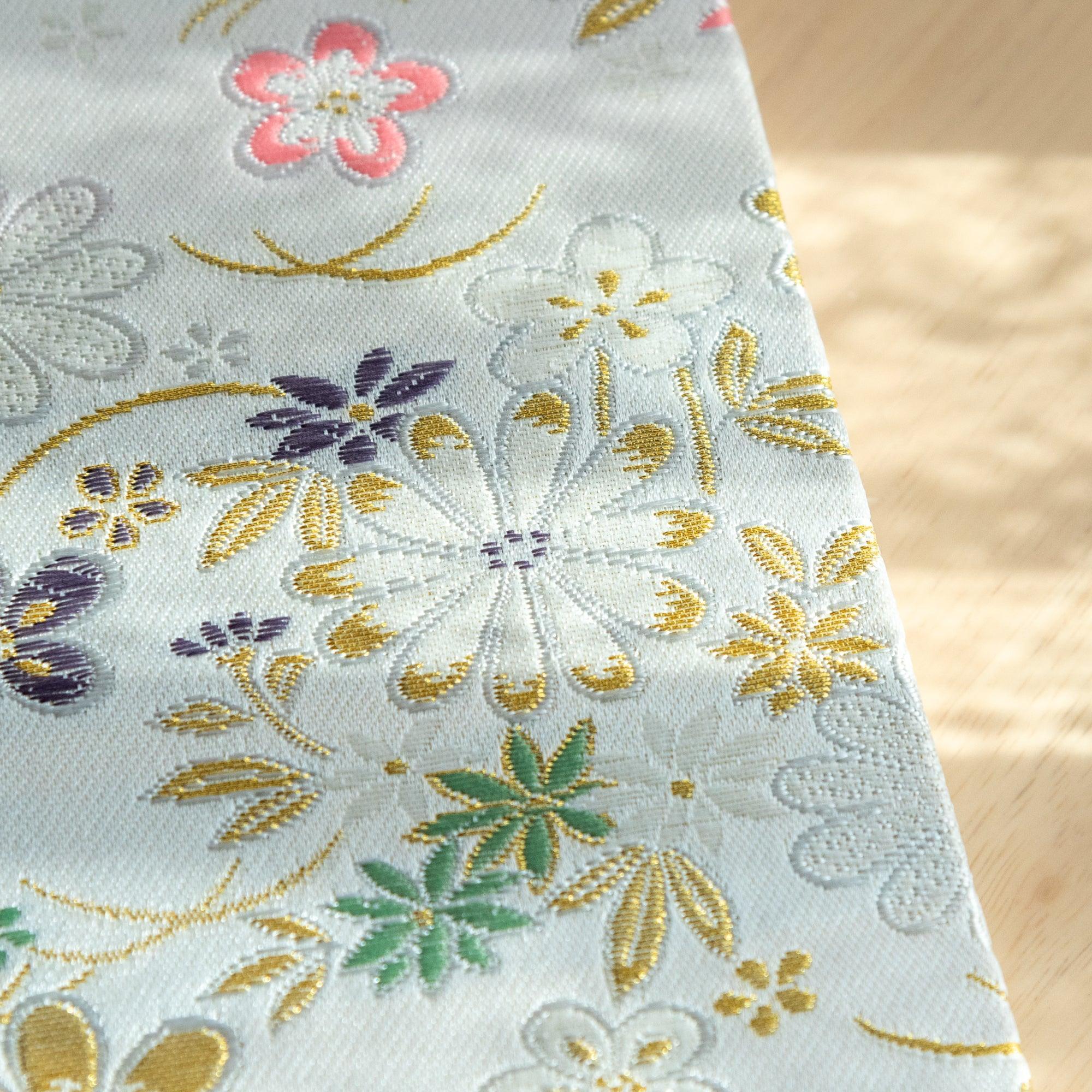 Nishijin Elegant Floral Weave B6 journal, spine with gold embossing on textile craft detail with binding
