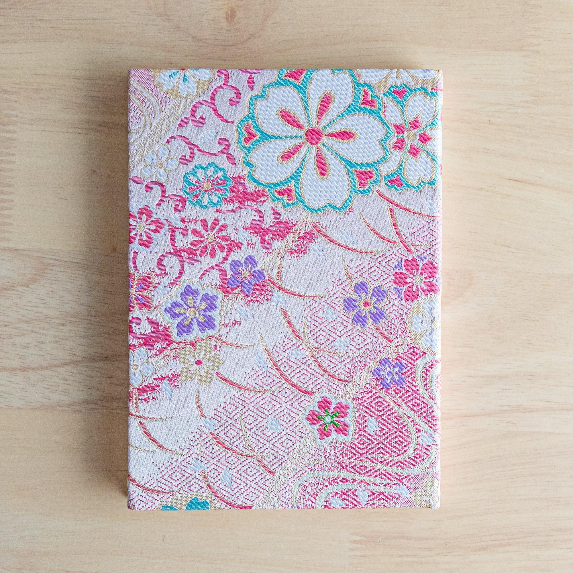 Nishijin textile B6 notebook, corner detail of traditional sakura brocade weaving craft detail with binding