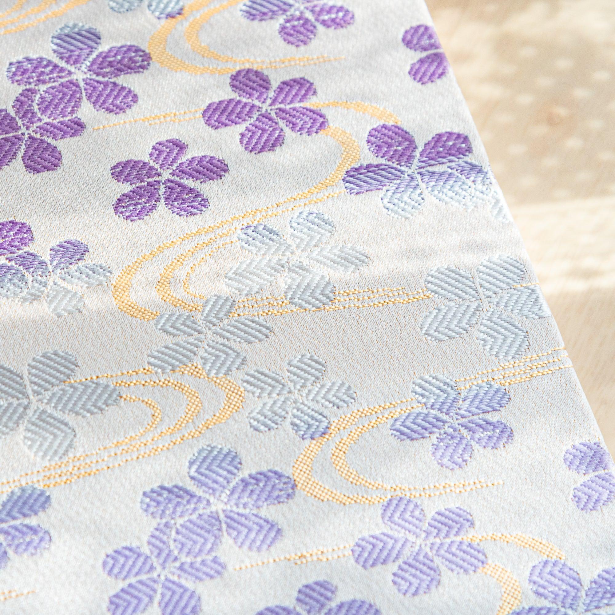 Nishijin Streamside Sakura Dreams B6 journal, spine with gold embossing on textile craft with binding