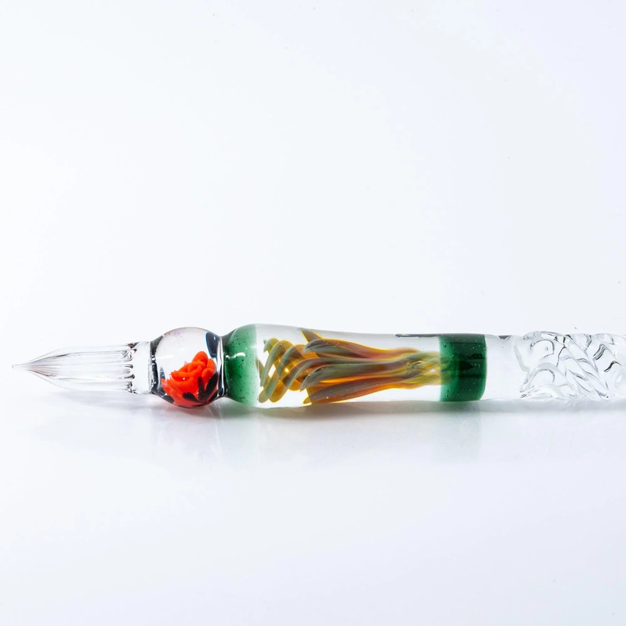 Rose-inspired Orange glass dip pen shown at angle displaying full barrel design and decorative metal nib with holder