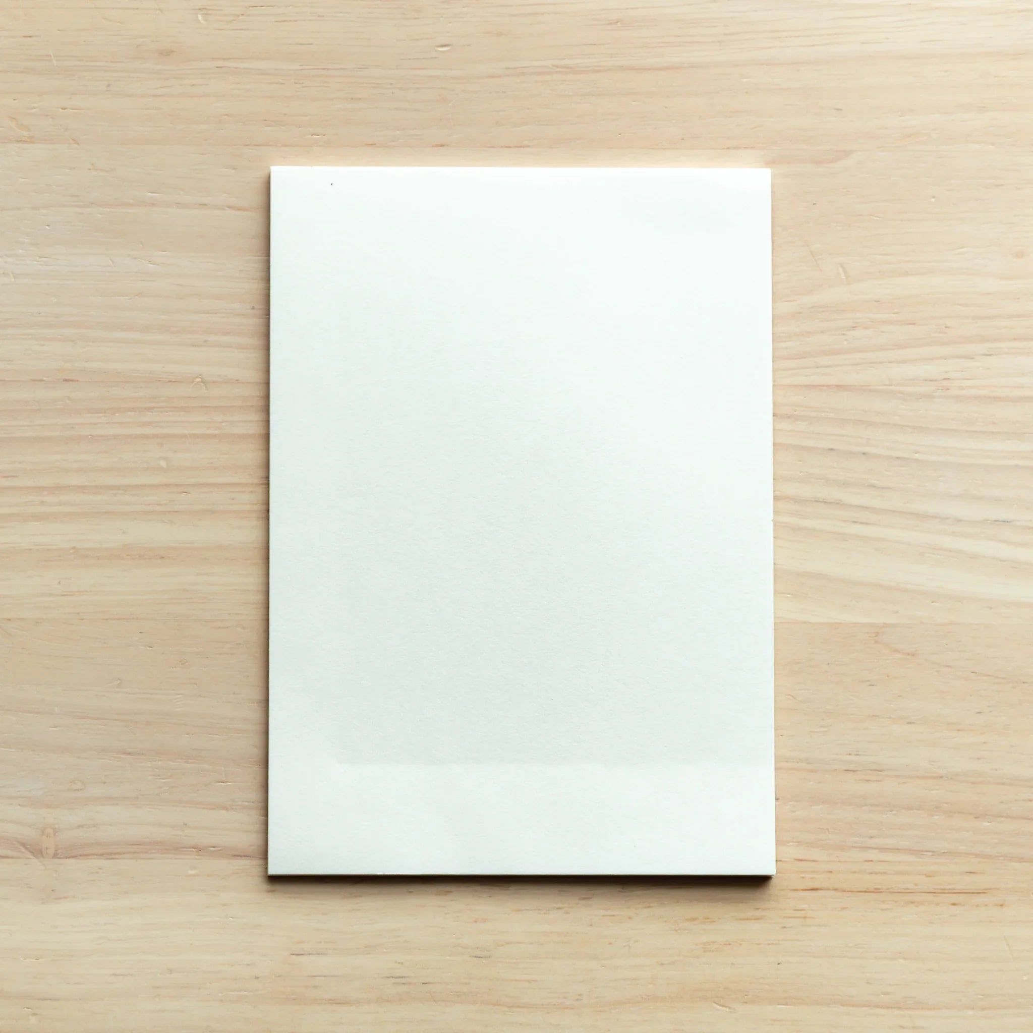 Individual washi paper sheet showing natural fiber content and artisanal texture from traditional paper making methods