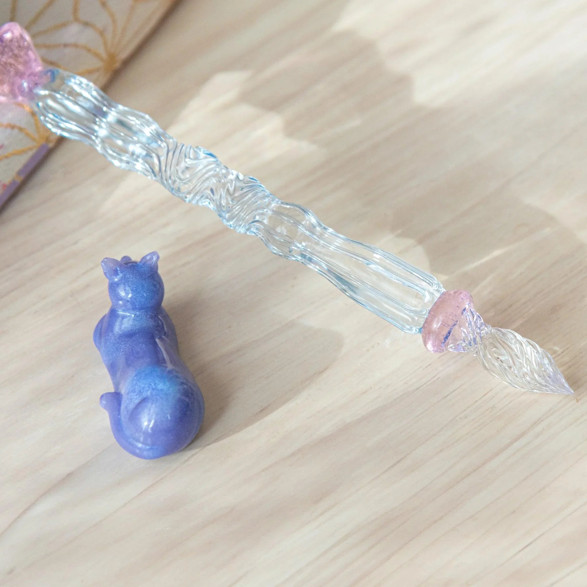 Pastel Purple Cat Glass Dip Pen artfully displayed resting on matching ceramic pen rest with Japanese aesthetic