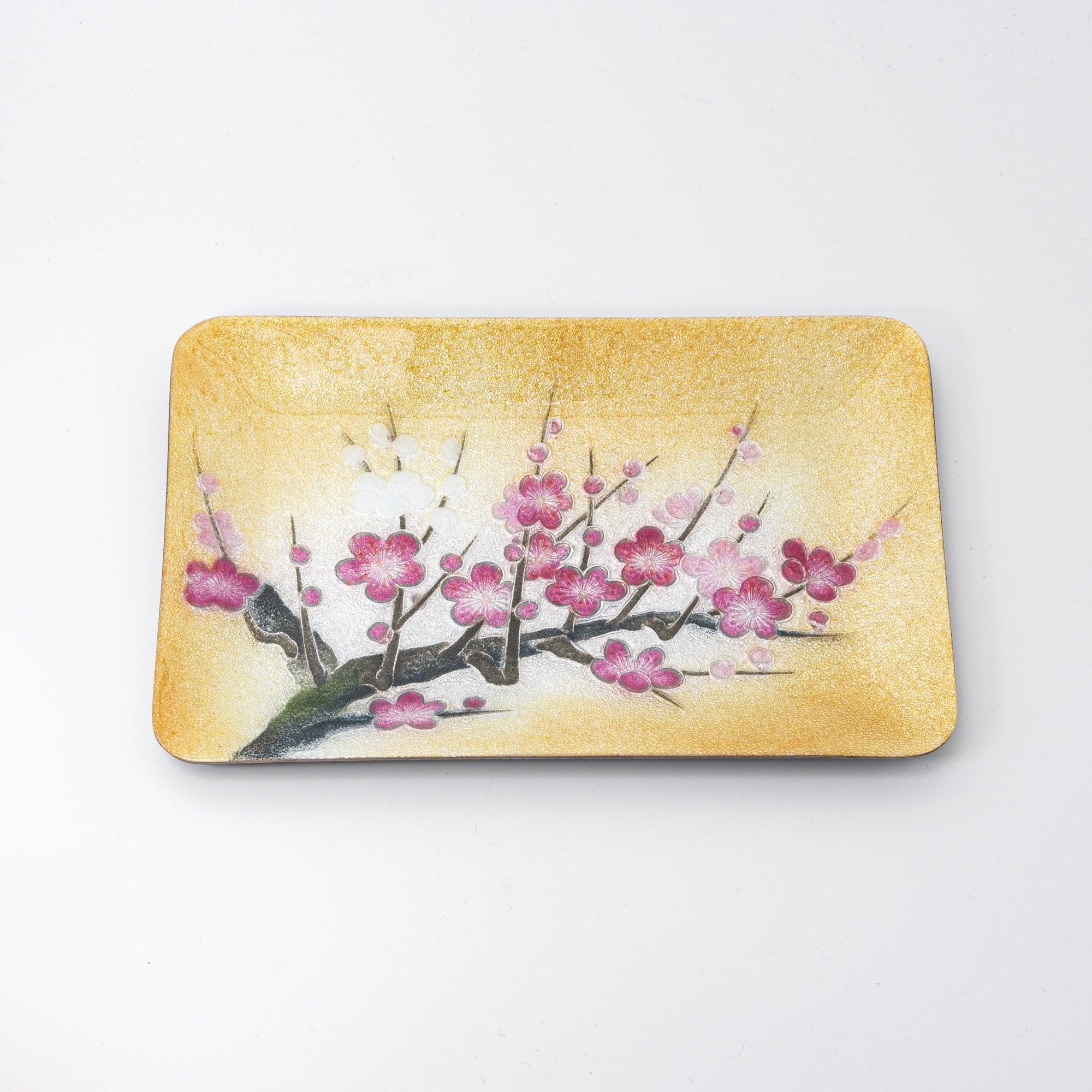 Plum shippo ware gold enamel pen tray, overhead view on white background showing pink and white plum blossom design