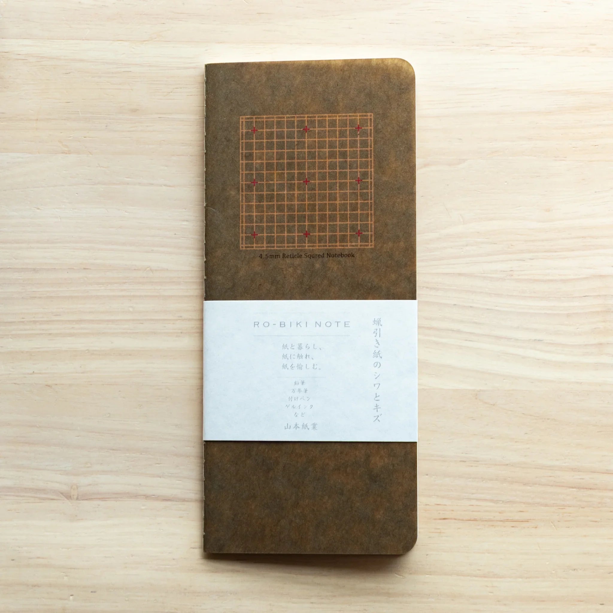 RO-BIKI Basic Series notebook with 4.5mm grid and cross marks displayed flat, showing slate cover and organized pattern