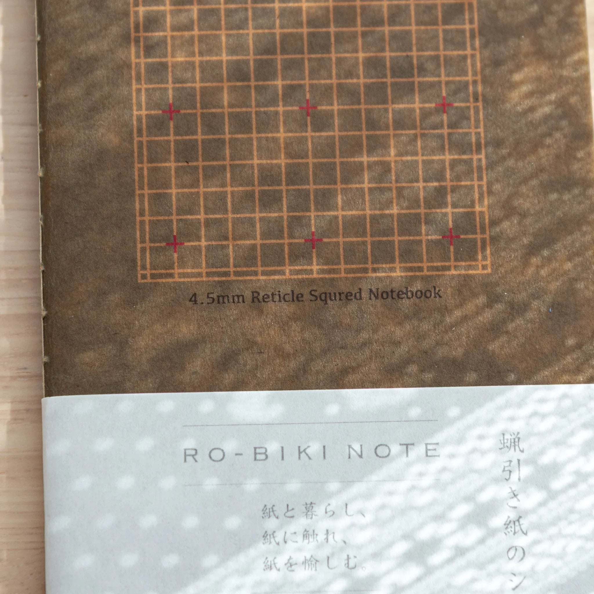 RO-BIKI Basic 4.5mm grid with cross marks notebook displayed flat showing cover and interior ruling layout