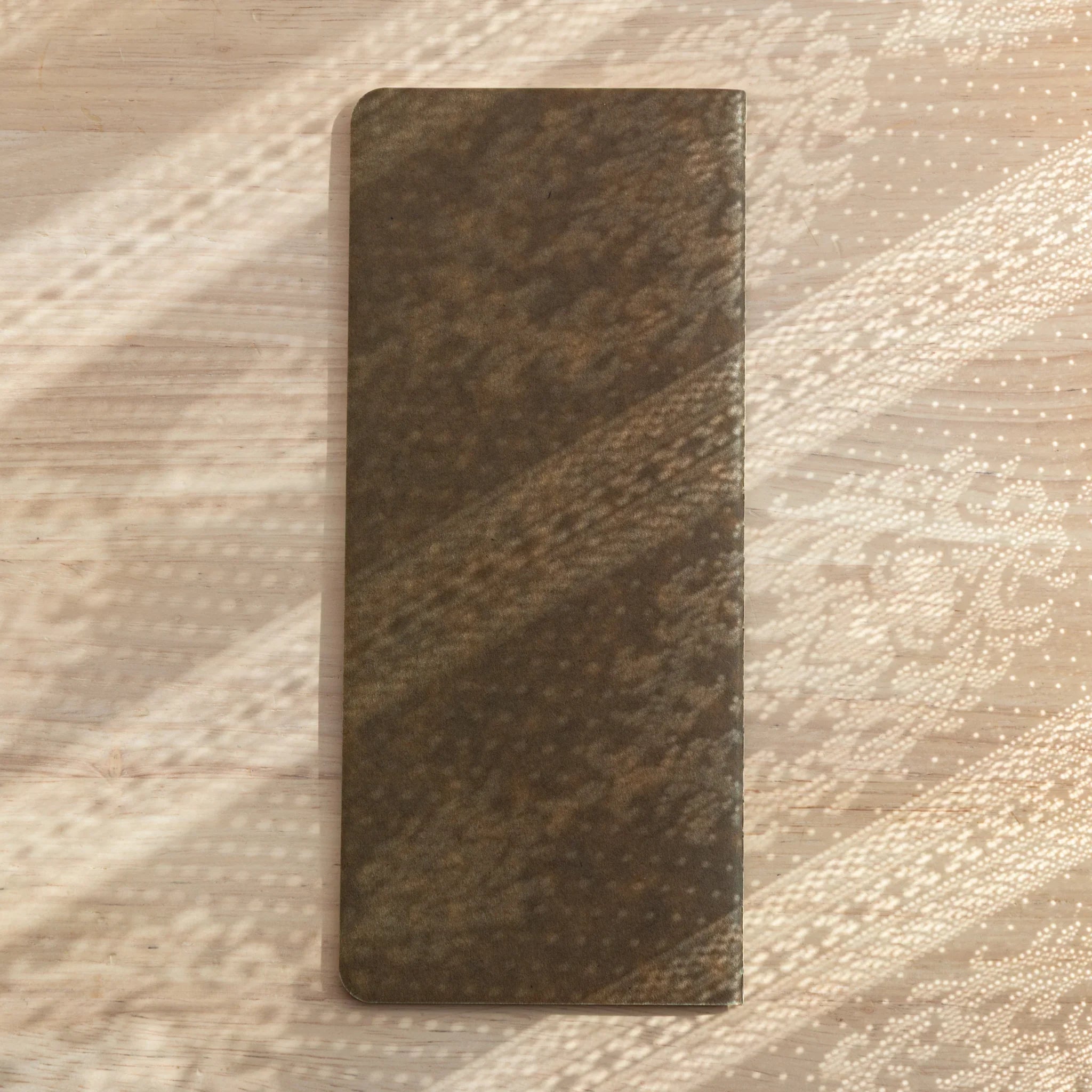 RO-BIKI Basic notebook with 4.5mm grid and cross marks displayed flat, showing slate cover and organized design