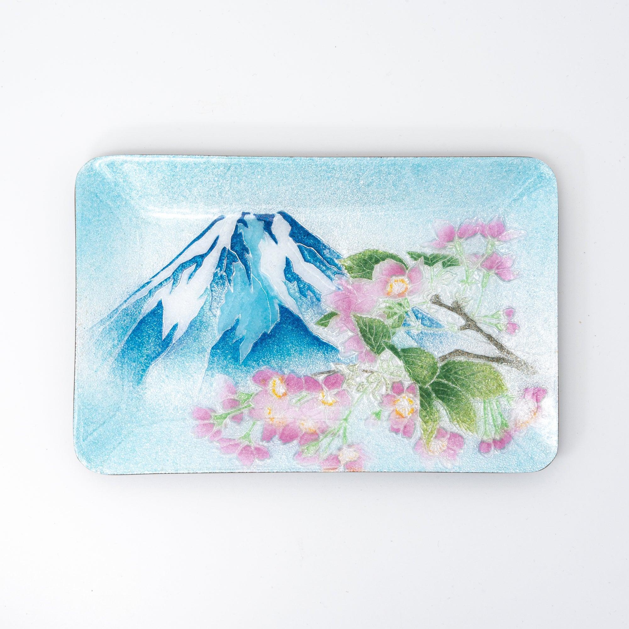 Japanese shippo ware pen tray viewed from above on white surface, showing blue enamel Mt. Fuji and pink sakura design