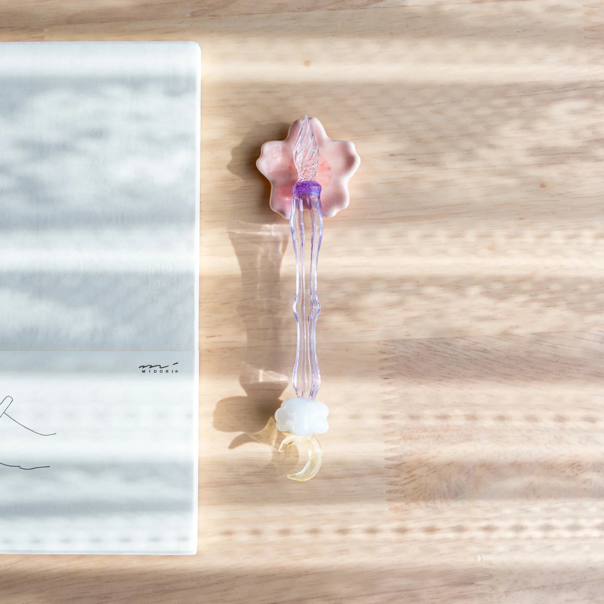 Japanese cherry blossom handcrafted pen rest in blush pink with six-petal sakura flower shape showing spring petal detail