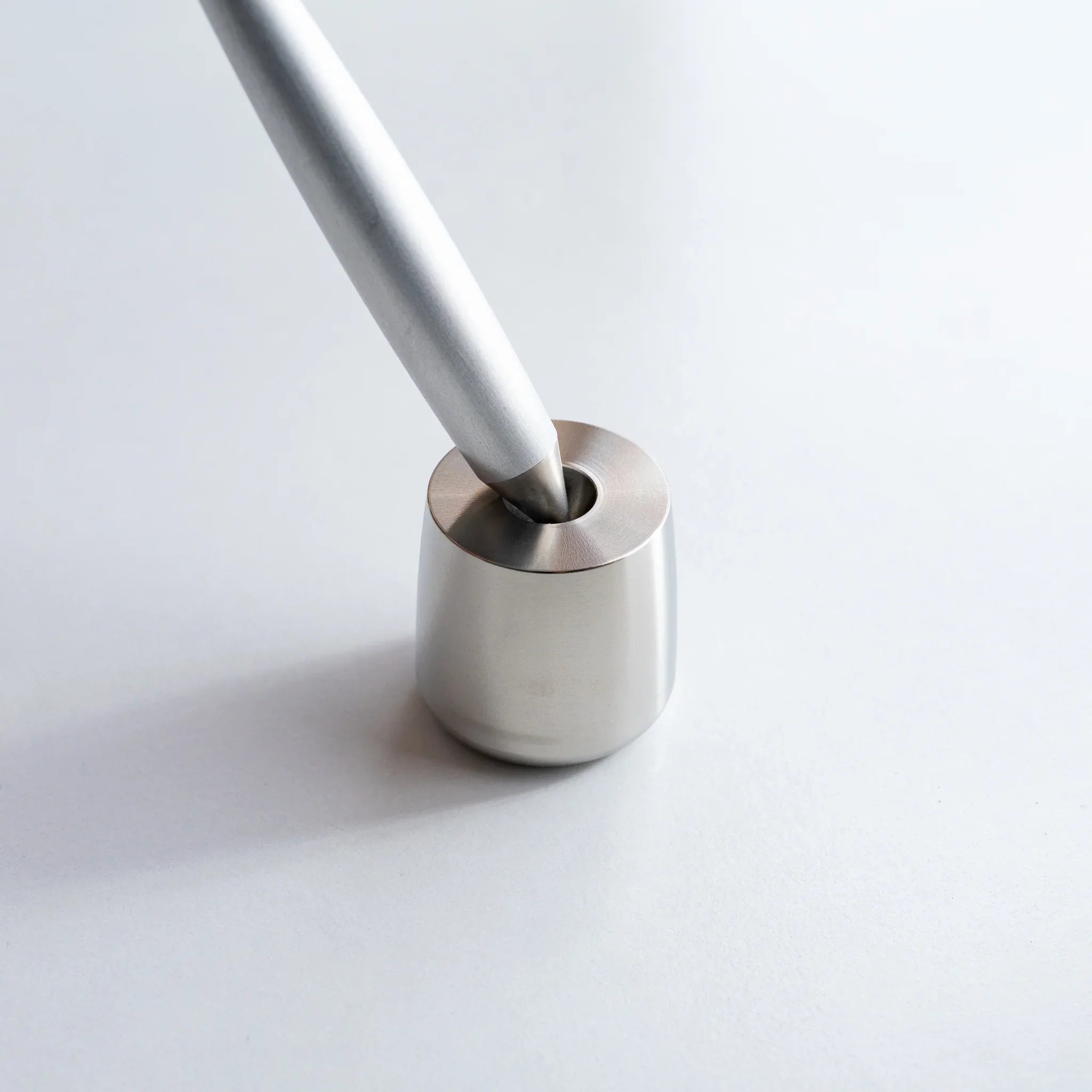 Solid stainless steel pen holder showing metal holder with polished finish detail