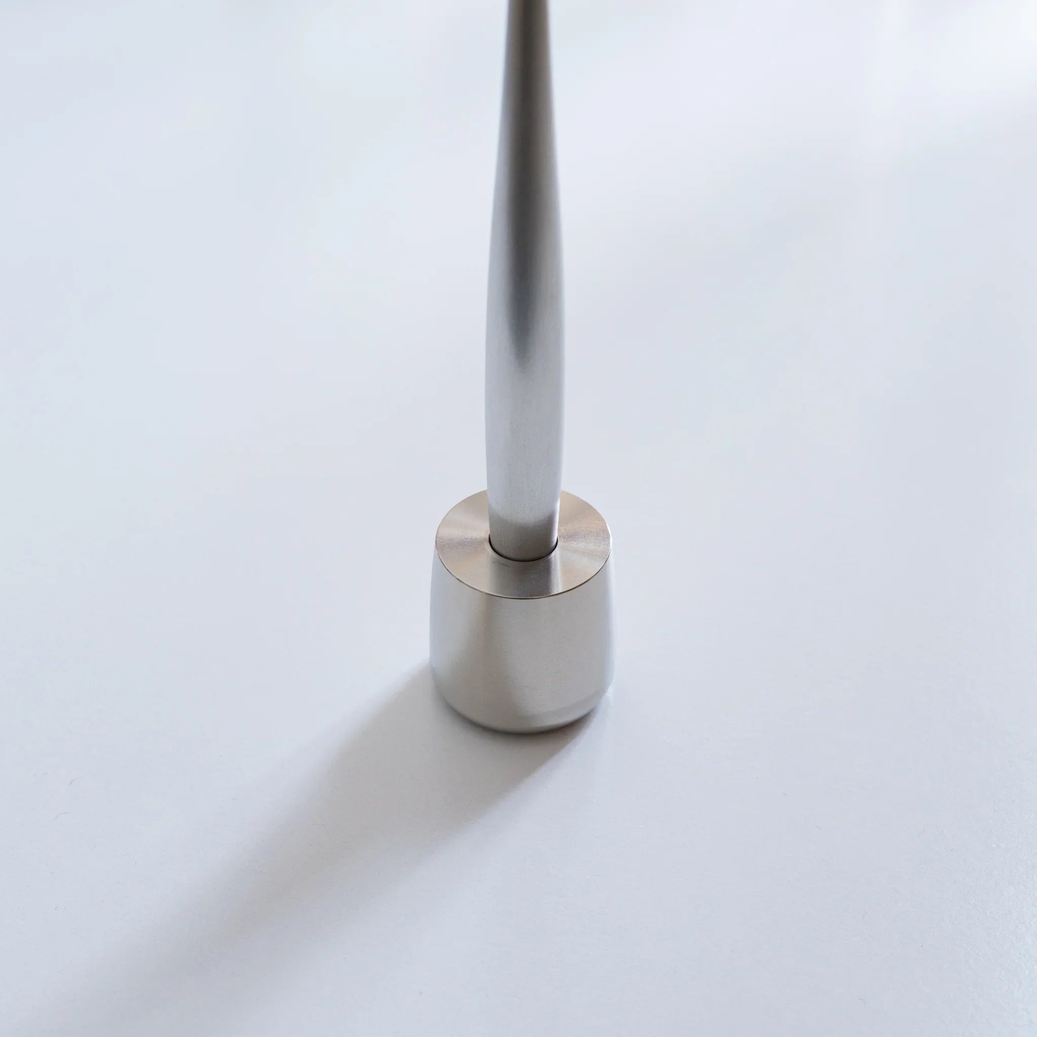 Solid stainless steel pen holder displaying full steel construction with finish