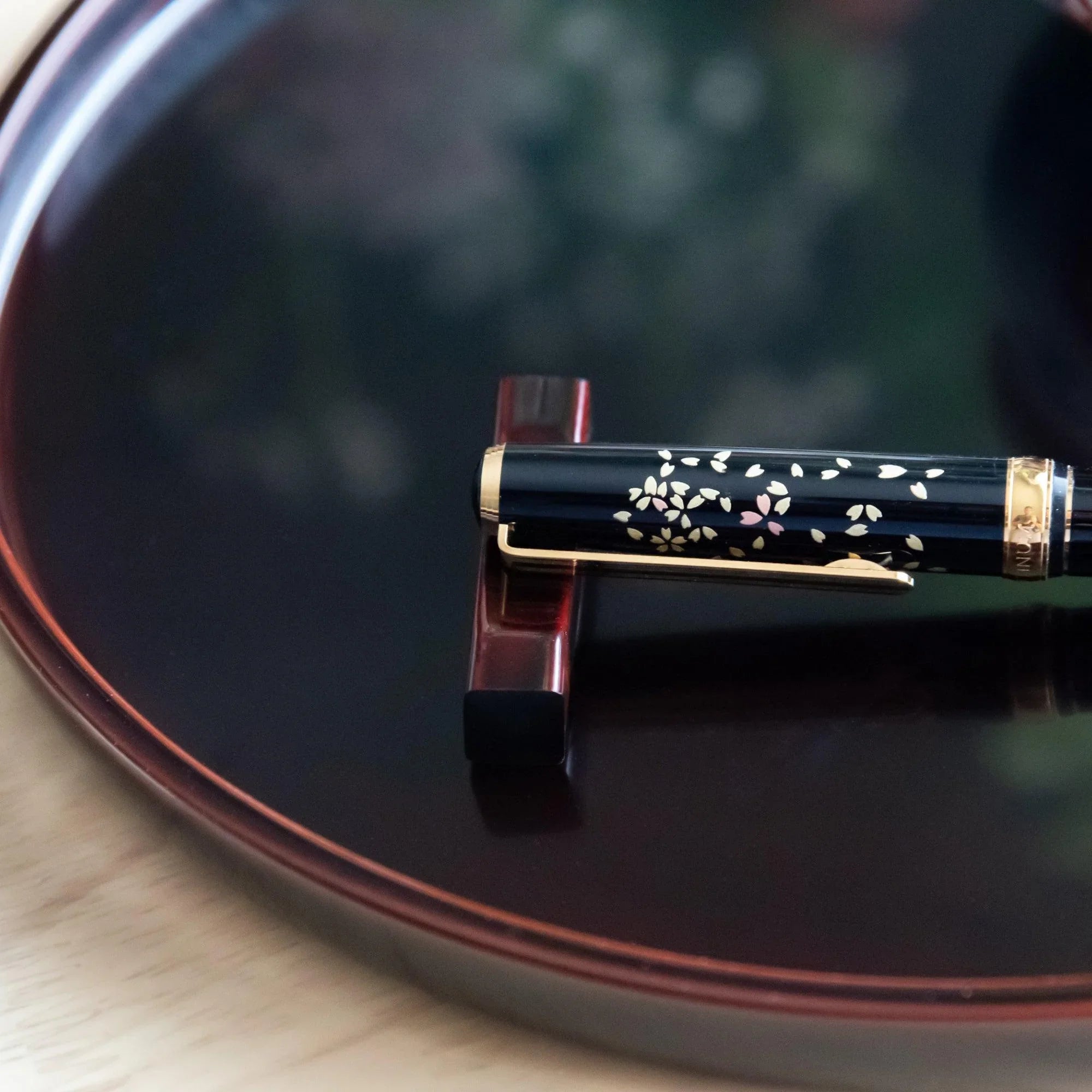 hand-made Tame-Nuri black lacquered pen rest from sakura wood features weathered finish, keeping pens secure during work