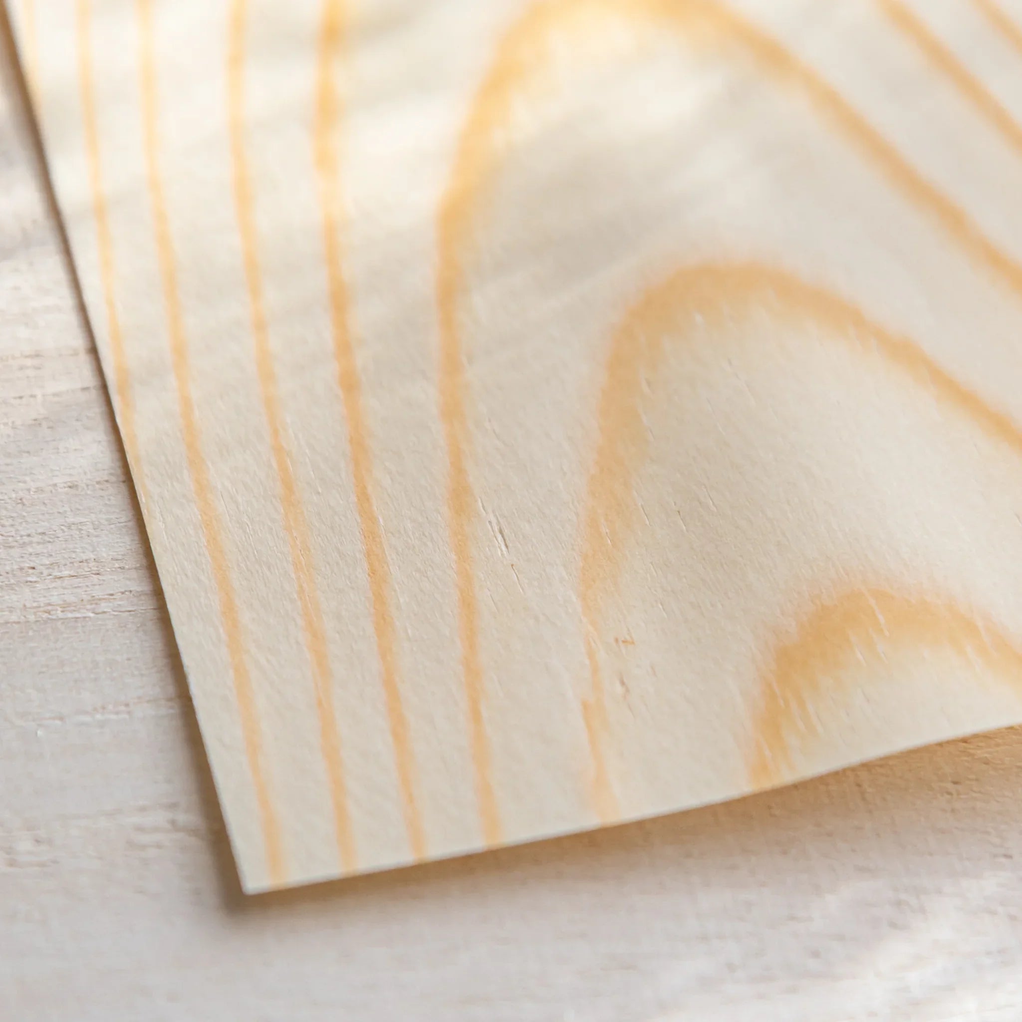 Japanese Stationery thin wood message card showing natural pine grain in close-up detail view on light desk display