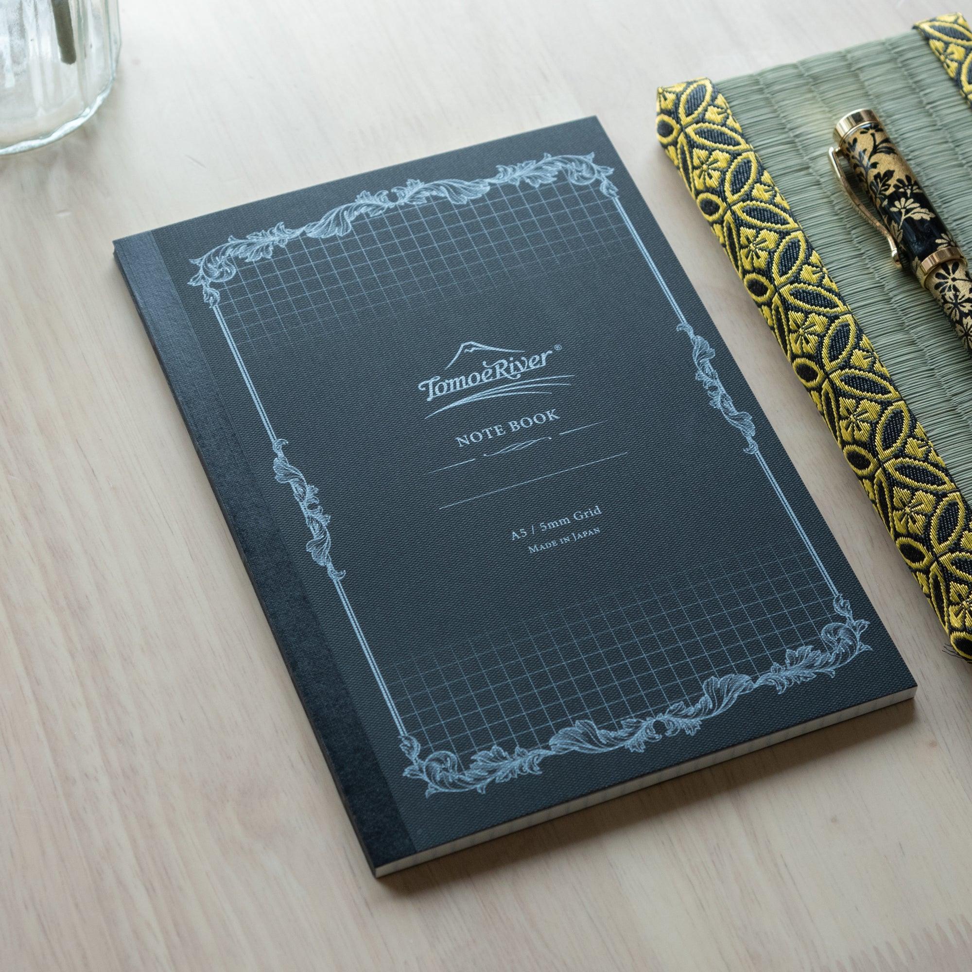 Sanzen soft cover A5 notebook with quality paper, overhead product photography of closed journal composition