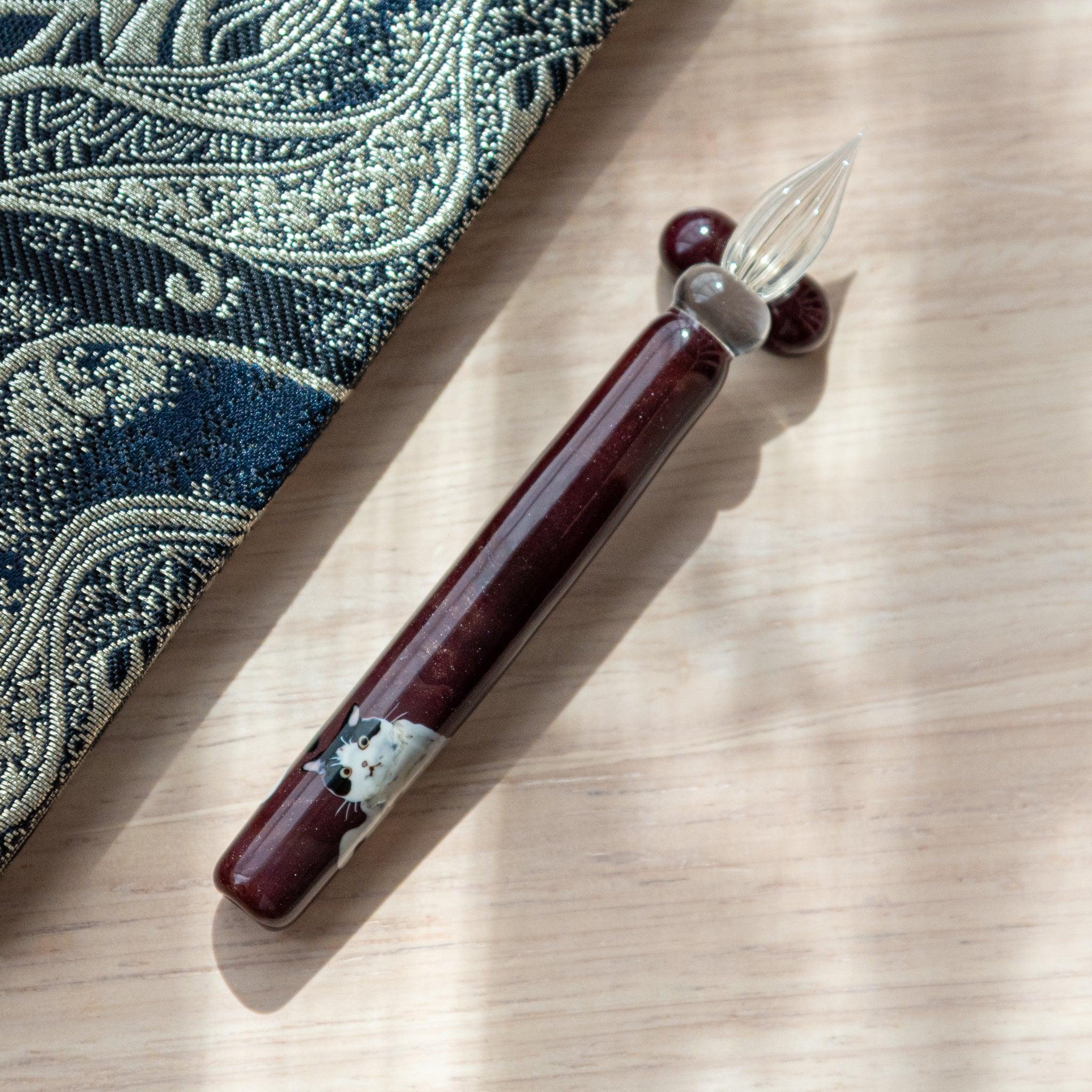Tuxedo Cat Glass Dip Pen with Pen Rest with matching black and white cat-themed ink and decorative cat notepad design
