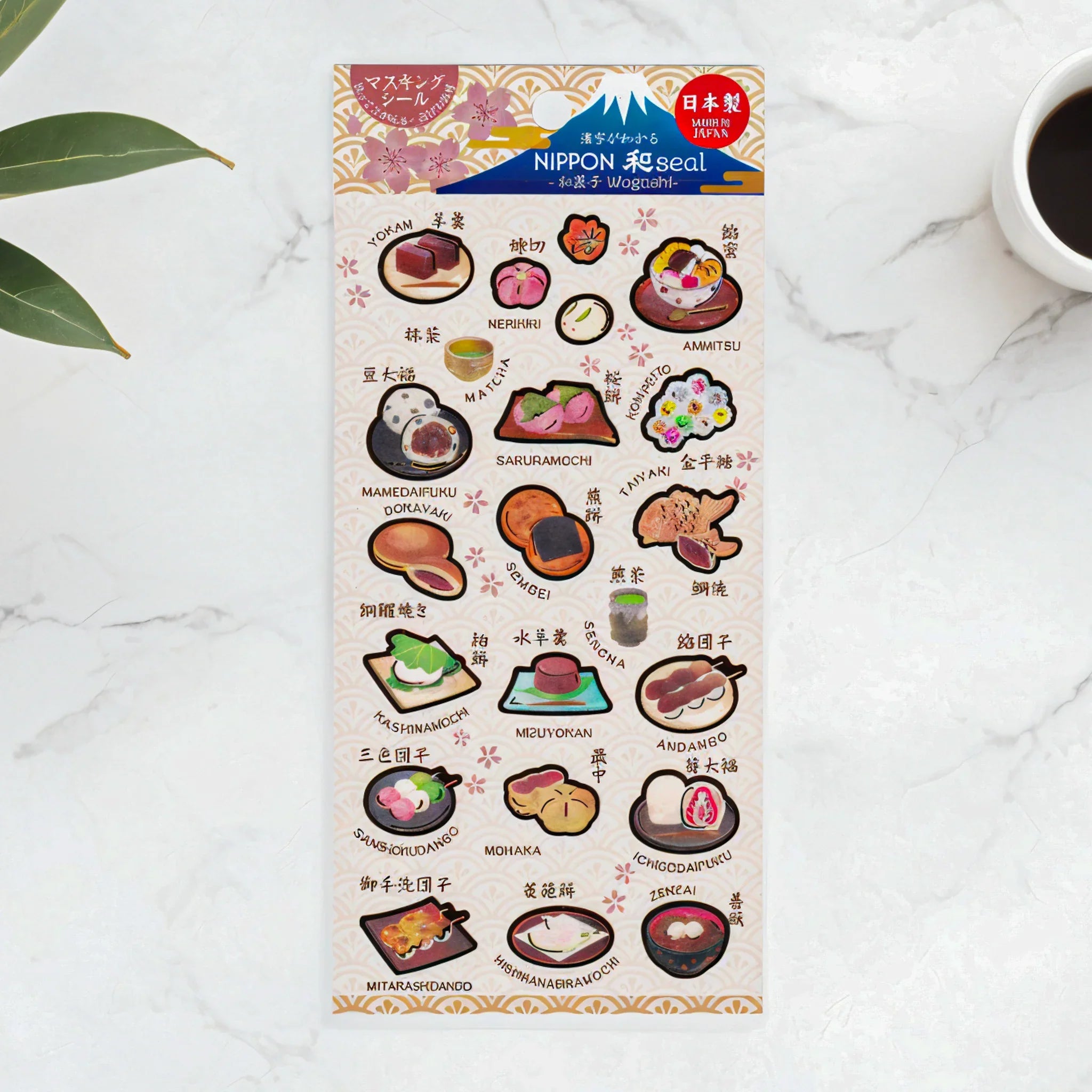 Wagashi Iyo washi sticker sheet flat lay on white marble surface with traditional Japanese sweets and confectionery labels