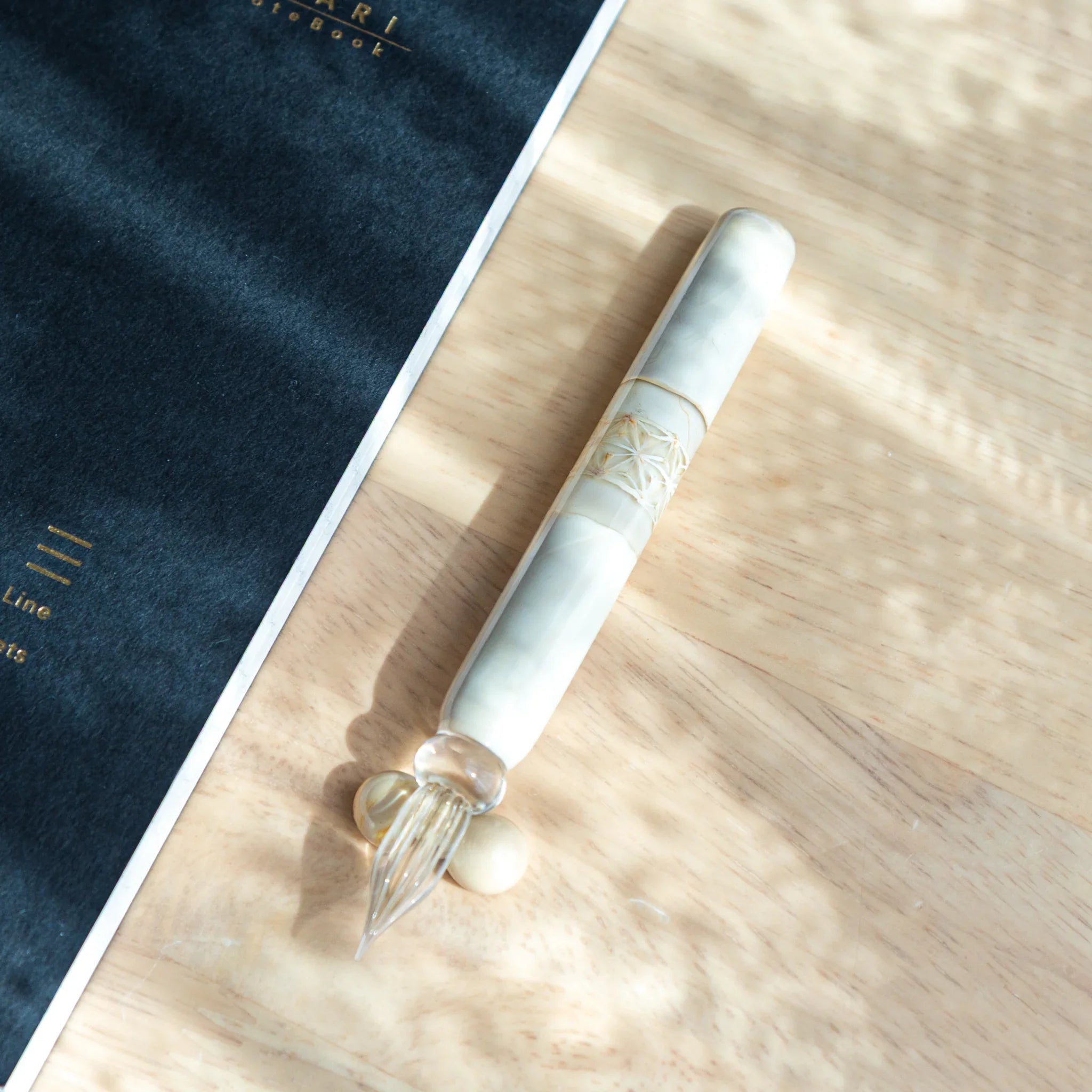 White hemp leaves glass dip pen detail showing traditional asa no ha geometric hemp pattern decoration