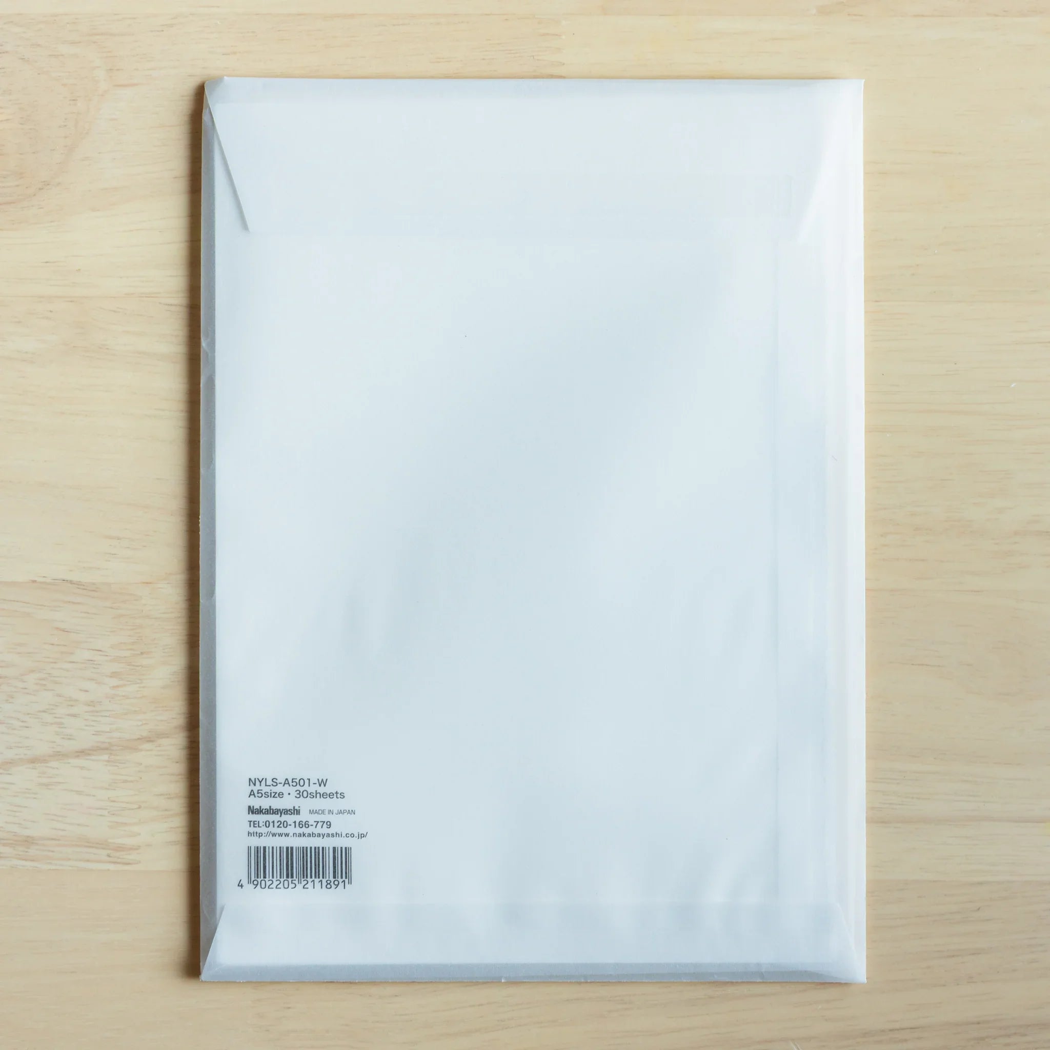 YU-SARI loose leaf paper sheets display flat lay on wood revealing smooth surface and quality construction