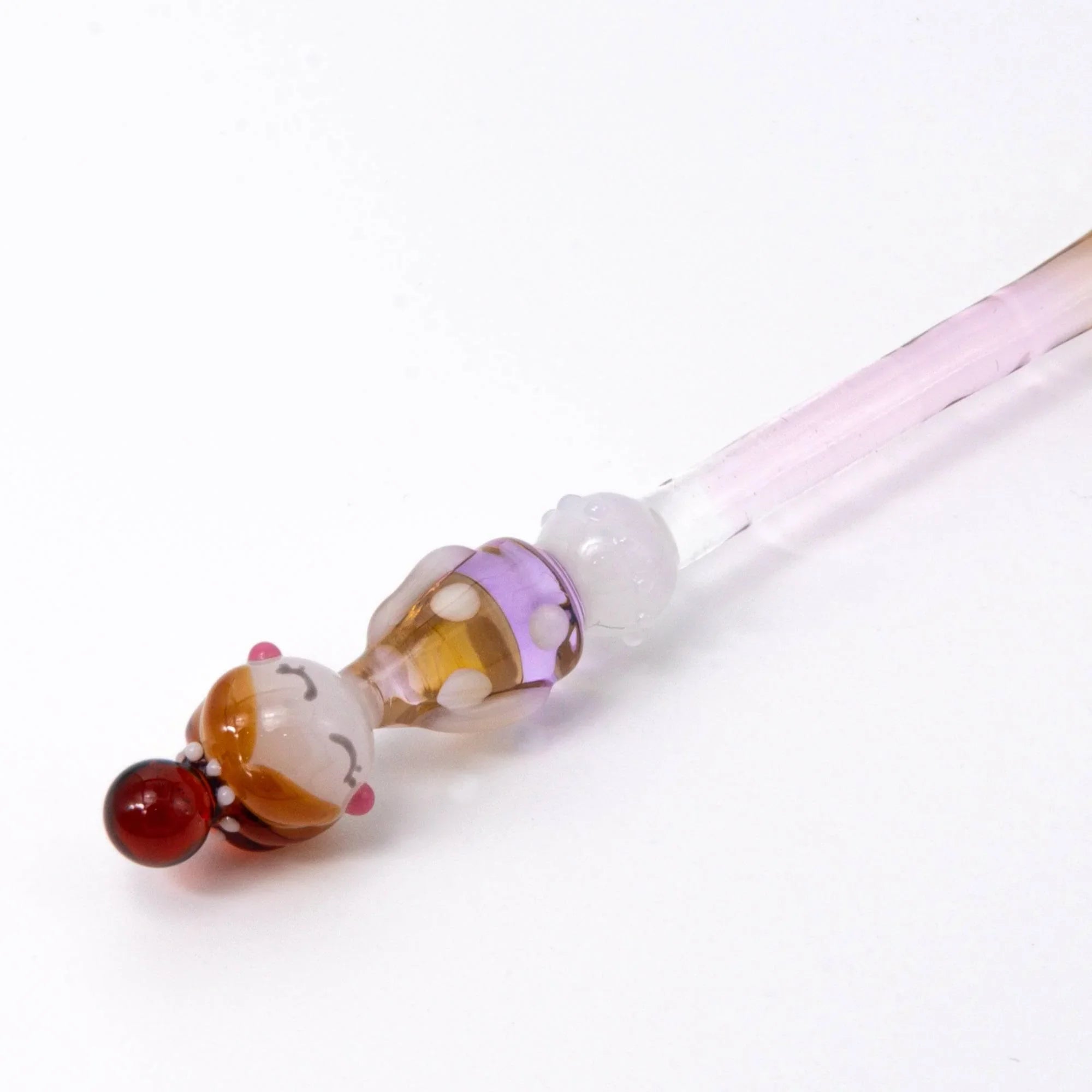 Fashionable Lady Marun-Chan glass pen showing reddish character and polka-dot glass barrel with handle detail and decorative