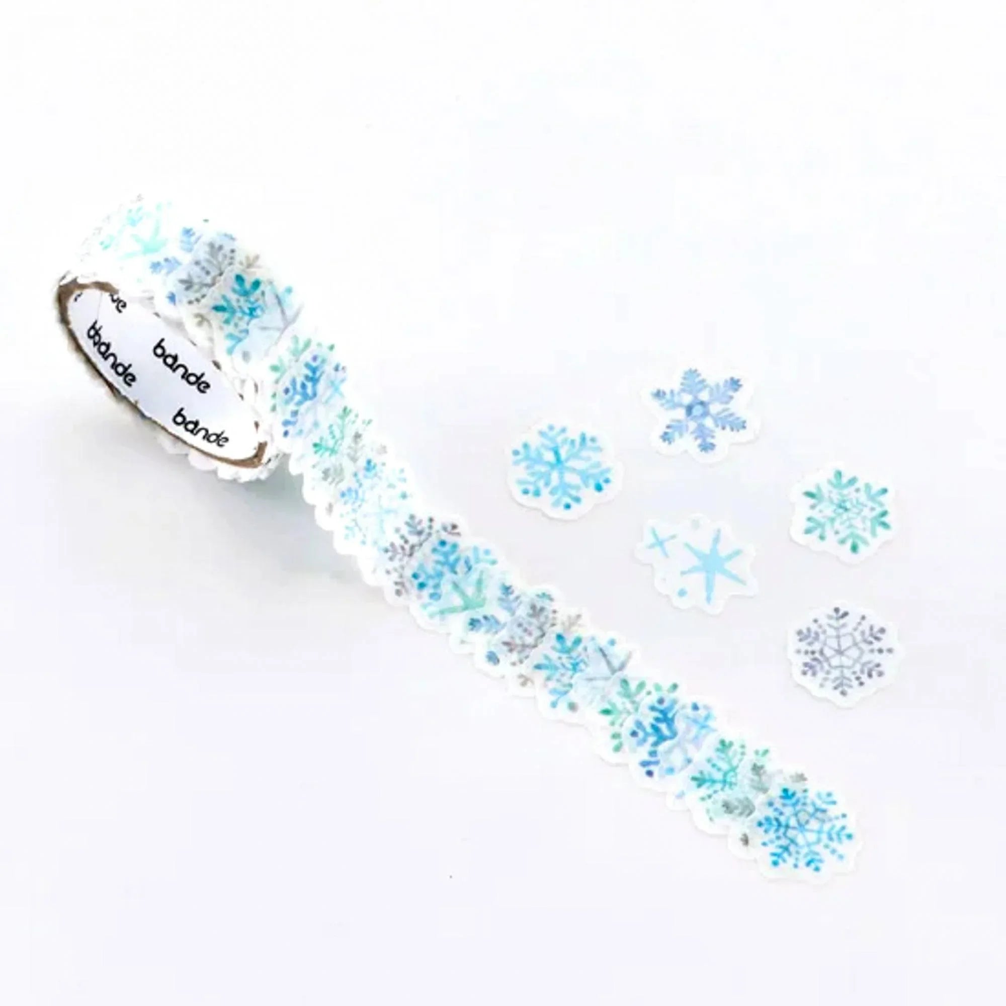 Glimmer of Snow Bande washi tape sticker roll diagonal view with winter-themed sticker pattern designs