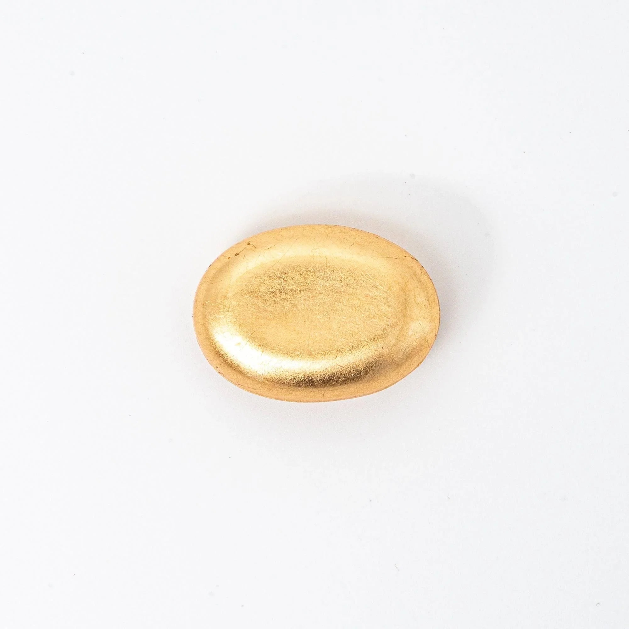Japanese gold-toned glass pen rest close-up detail showing textured surface and floating delicate gold leaf elements