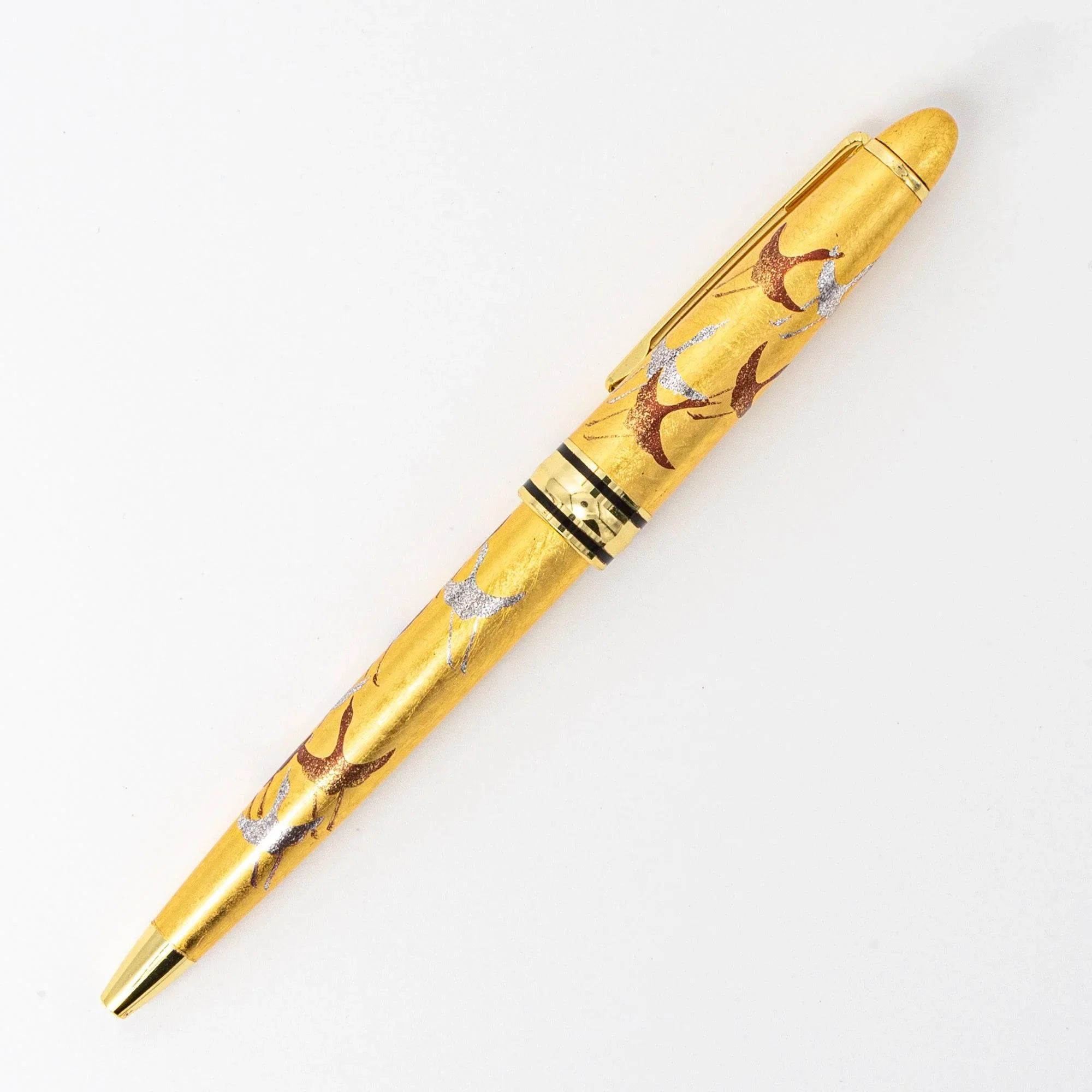 Three-quarter view Gold Leaf Makie Crane ballpoint pen with red-brown bird and gold leaf Japanese craftsmanship