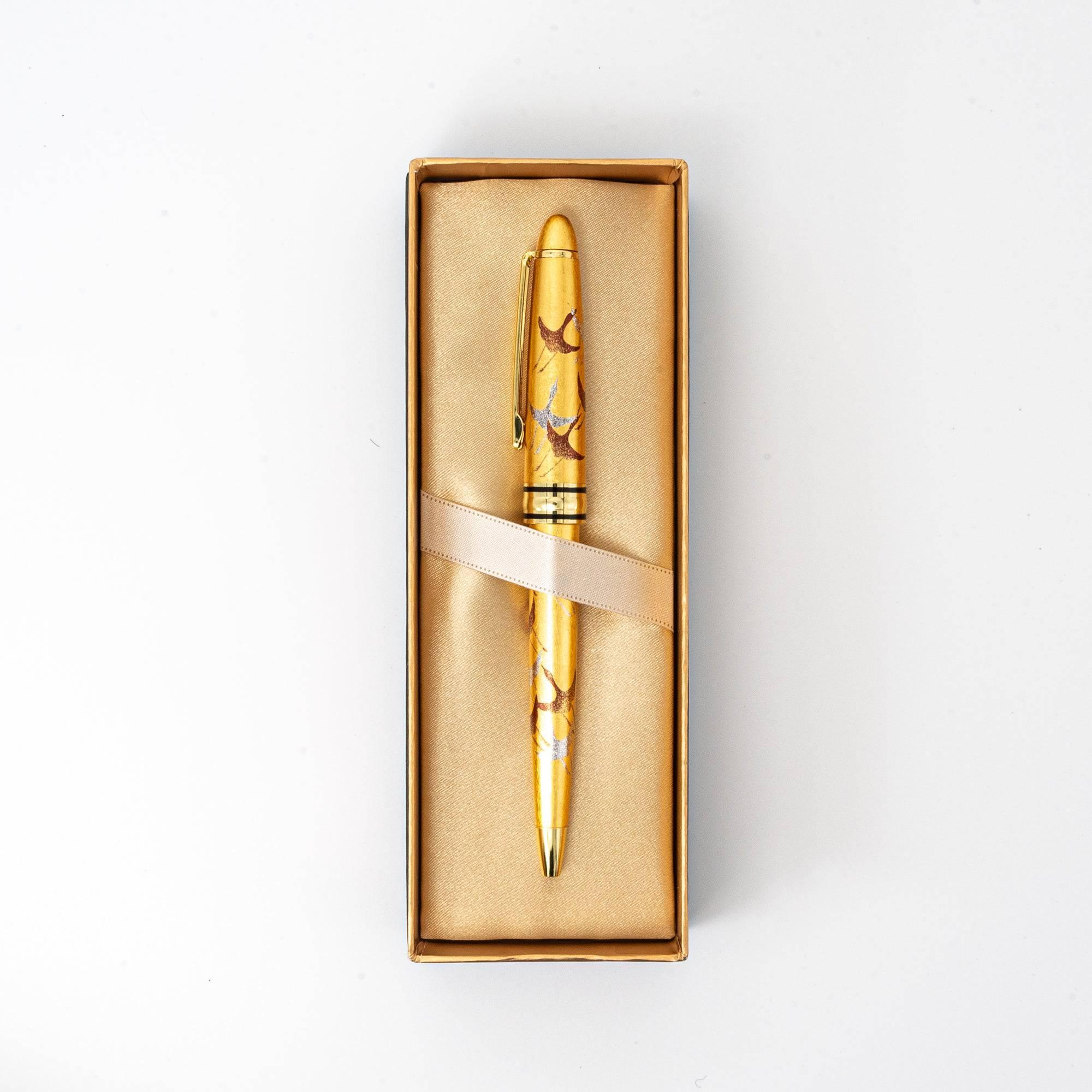 Uncapped Gold Leaf Crane Makie ballpoint pen displaying refined traditional crane illustration on barrel