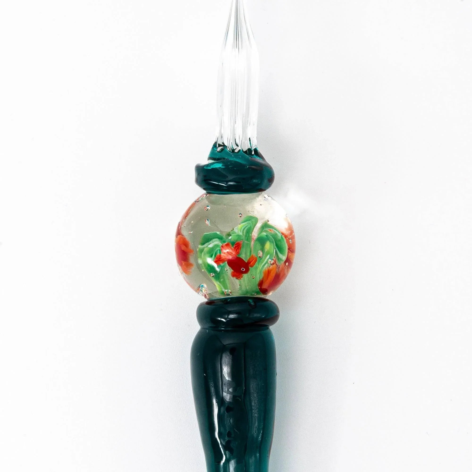 Japanese glass dip pen with aquarium barrel section containing orange goldfish and green aquatic plants, teal cap