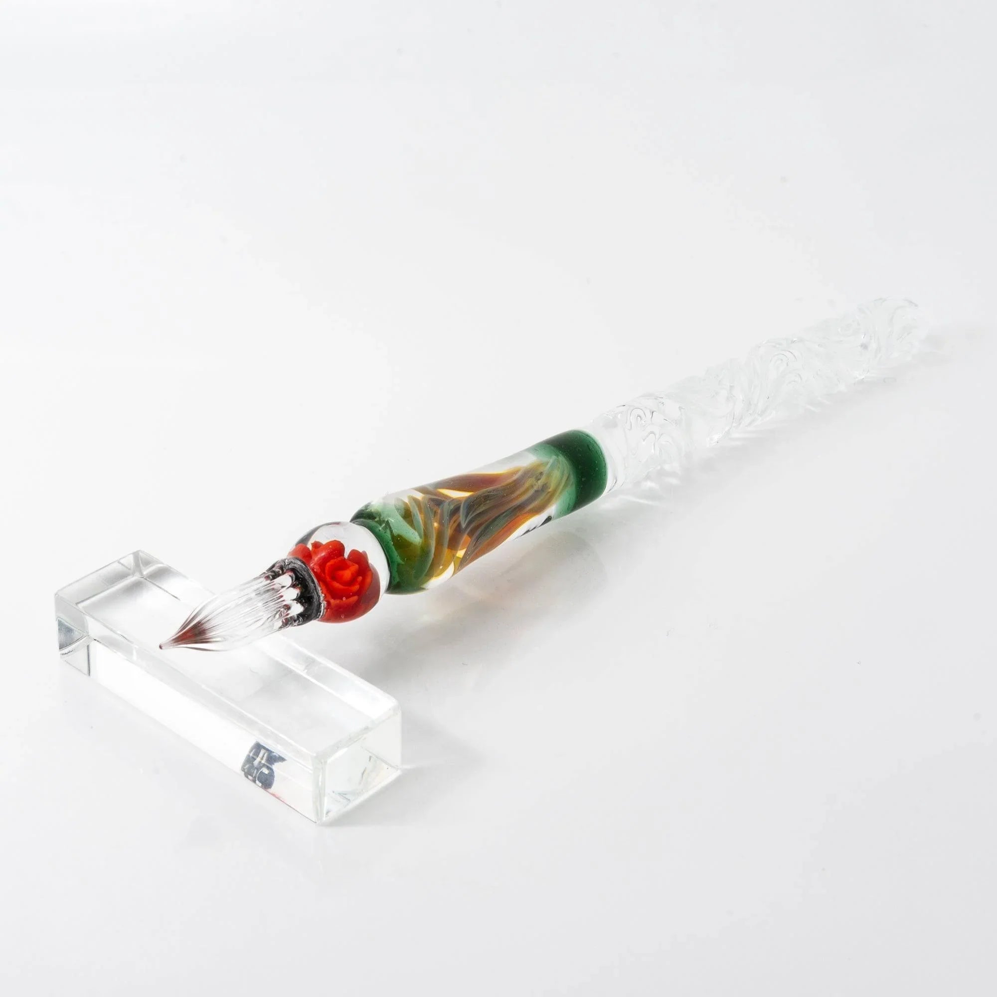 Overhead shot of Orange Rose glass dip pen highlighting hand-made rose-themed design and metal ferrule shine