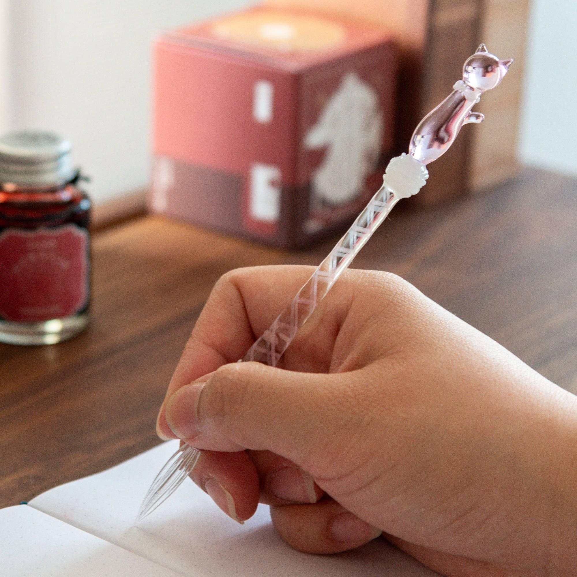 Pink Nyanko Cat glass dip pen detail close-up showing handle, decorative nib and cat character motif clearly emphasizing