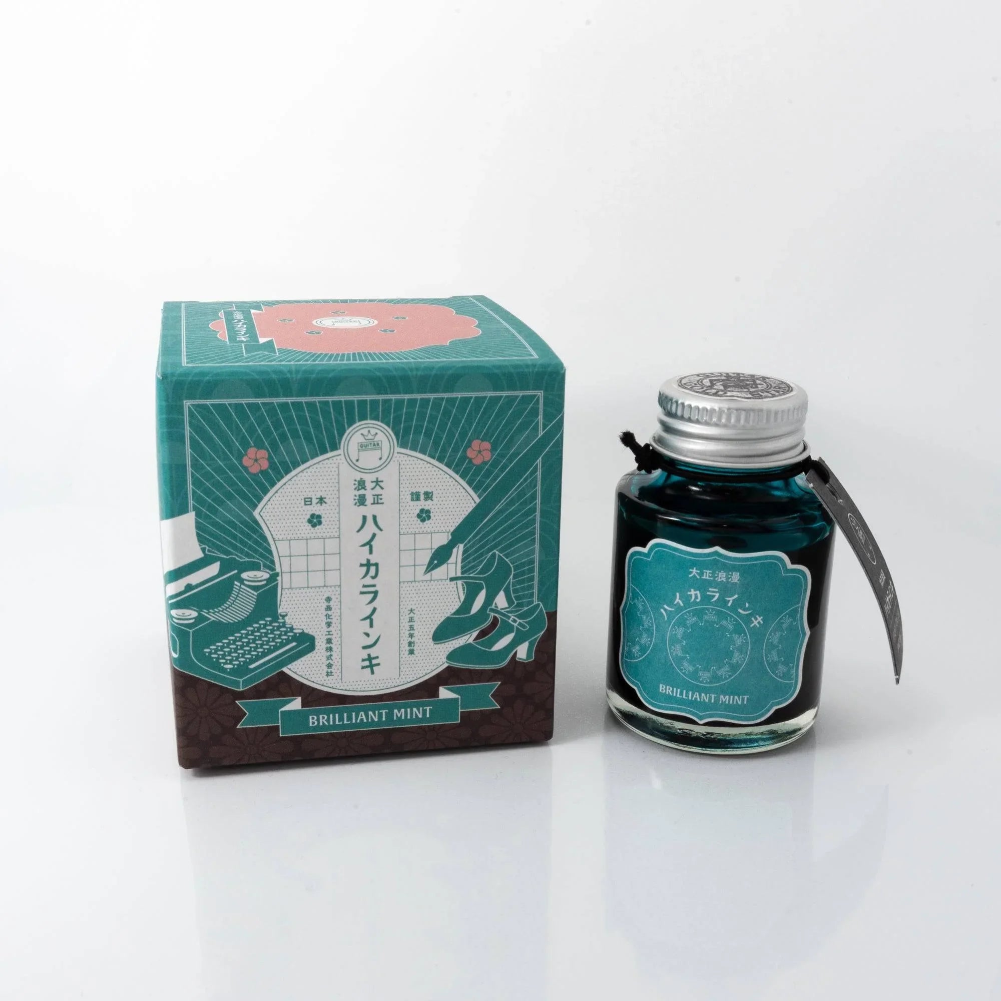 Taisho Romance Brilliant Mint fountain pen ink bottle with ornate art nouveau label design detail shot