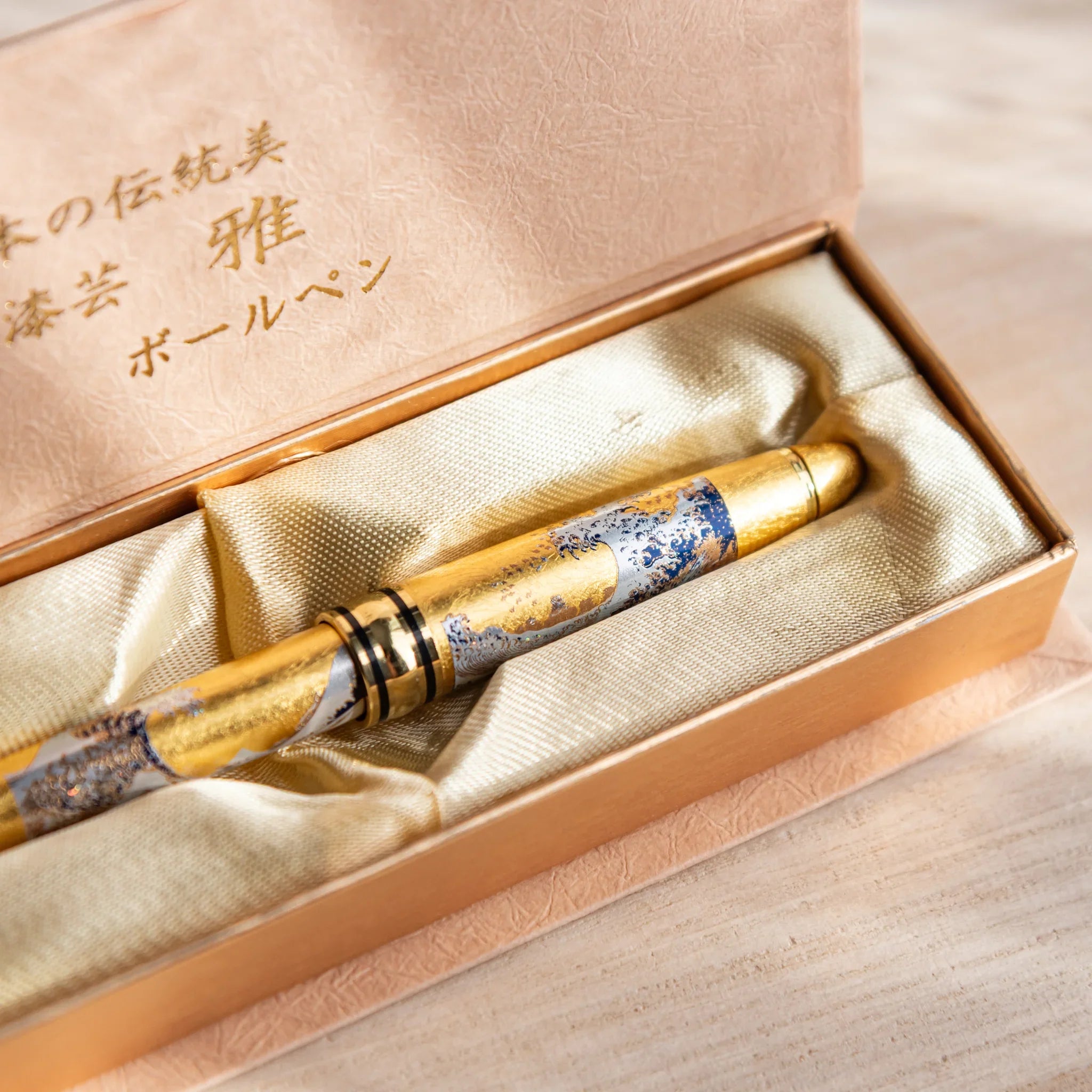 Great Wave artwork ballpoint with gold trim and lacquer finish composition design shown in composition