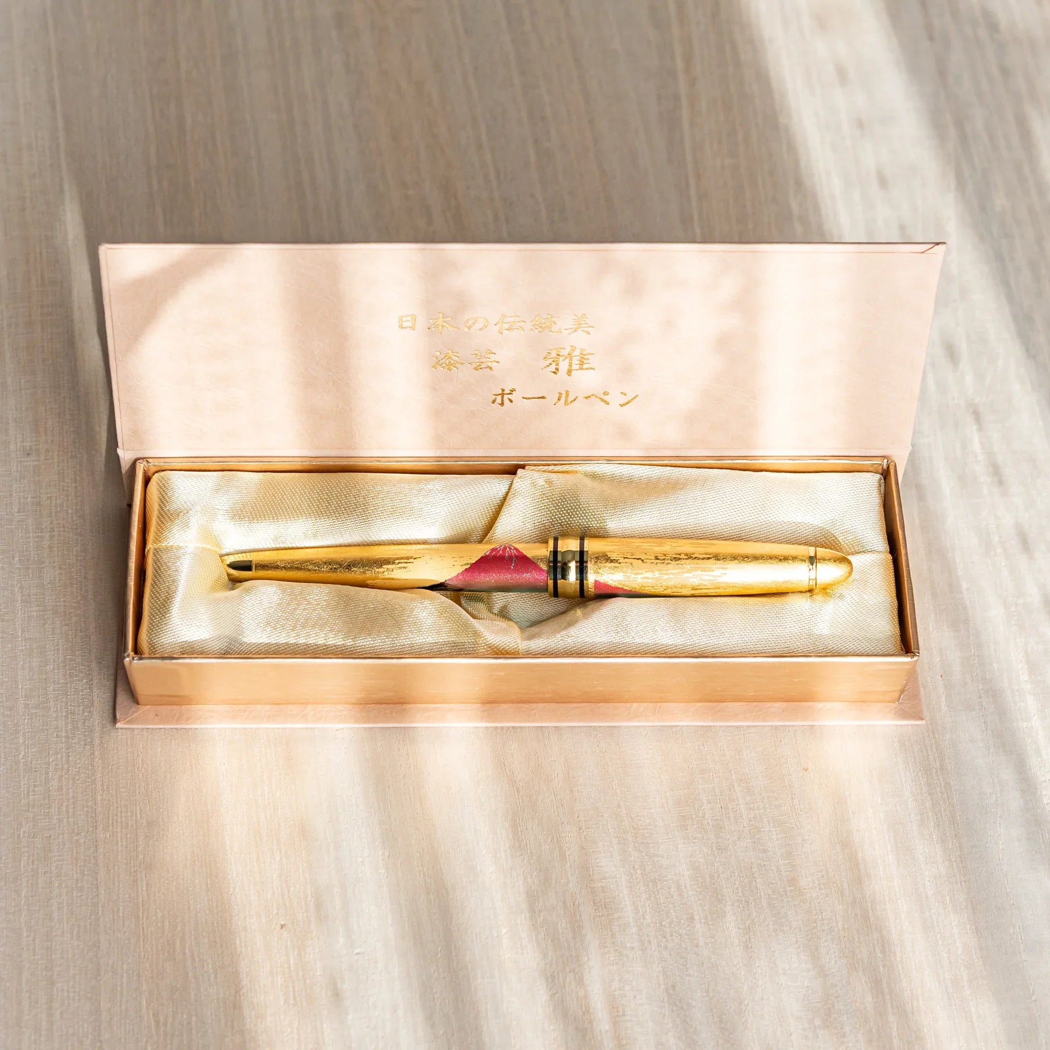 Fuji landscape ballpoint with gold accents on dark lacquer finish surface shown in composition composition shown