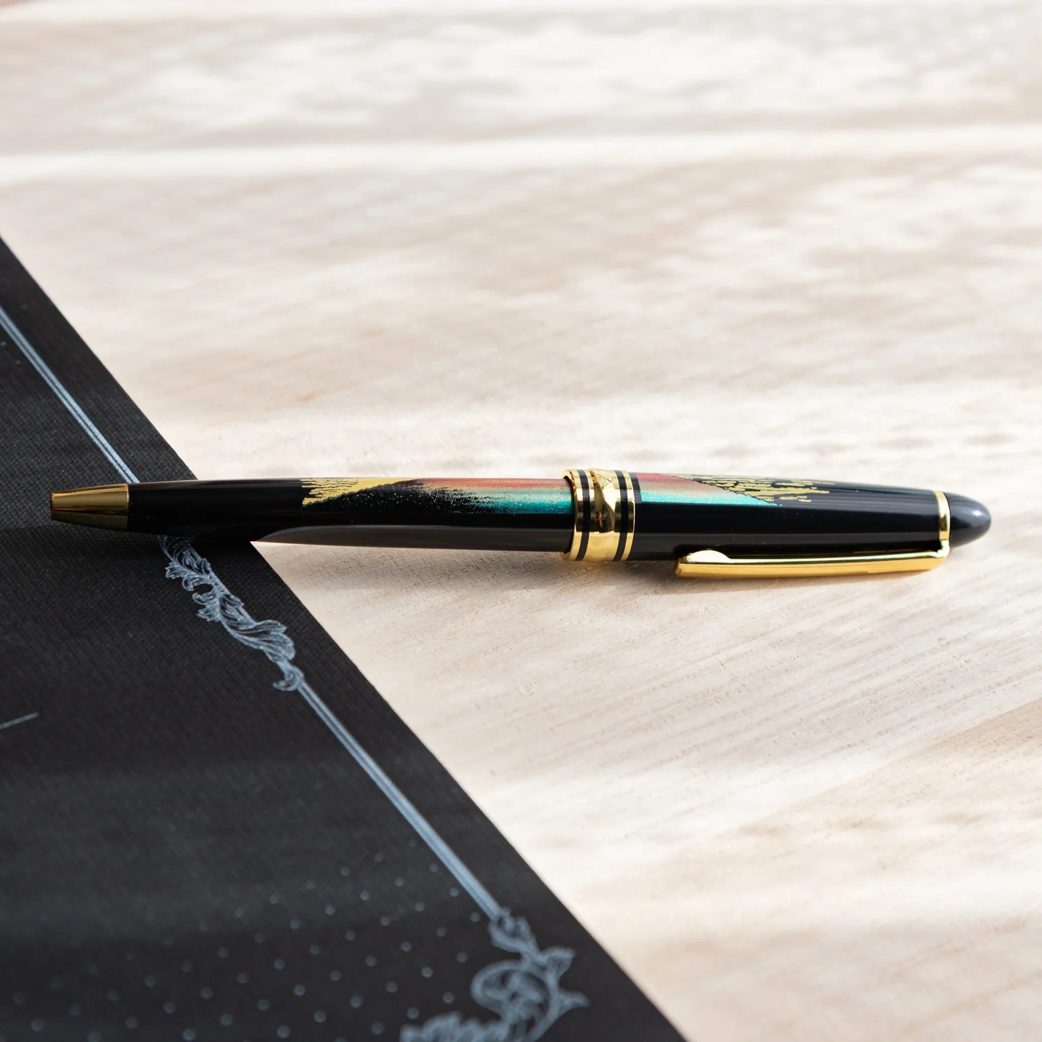 Red Mt.Fuji Yamanaka Retractable Ballpoint Pen, side profile view of product providing full visual representation and product