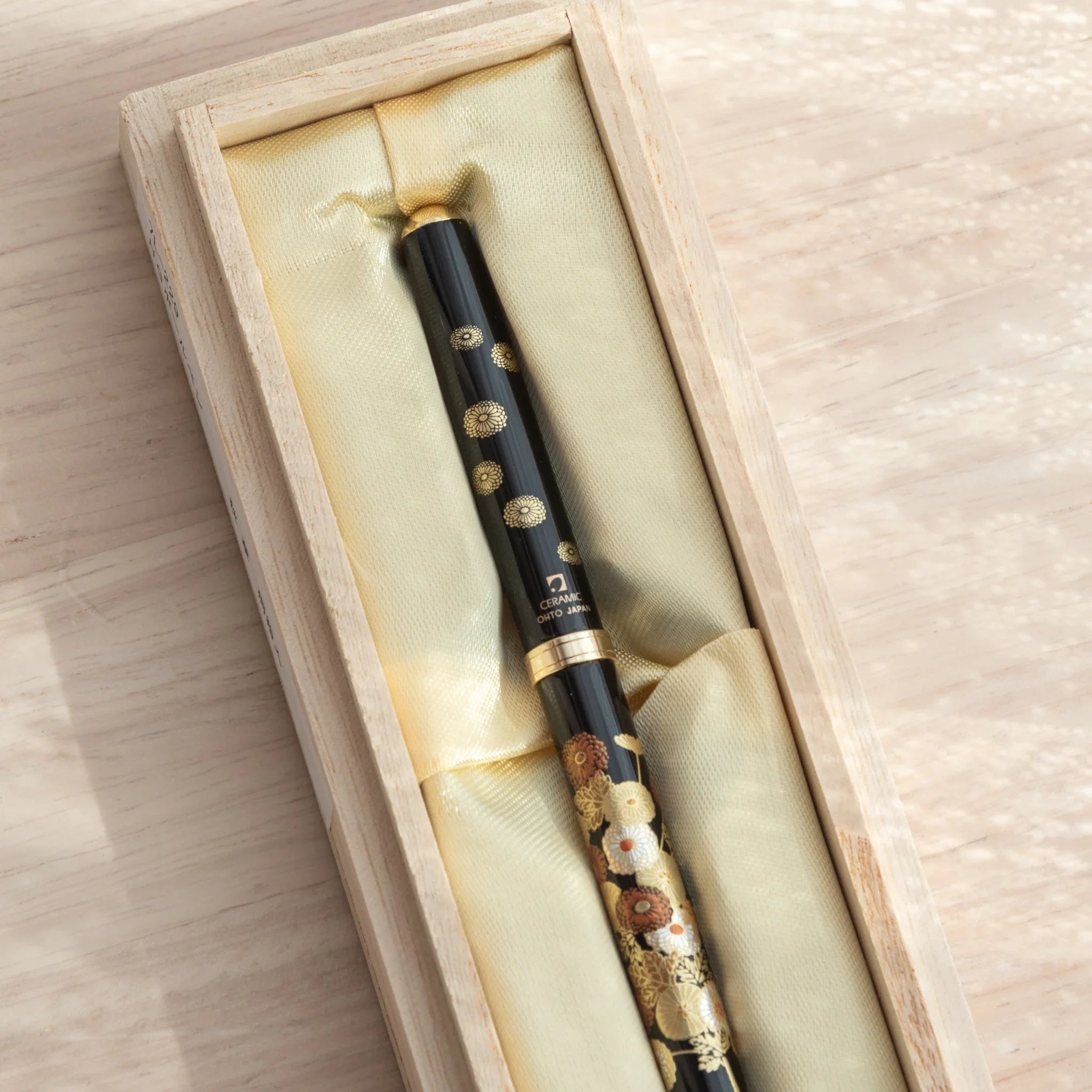 Yamanaka lacquered ballpoint pen displays vibrant autumn blossoms and leaf composition artistically made