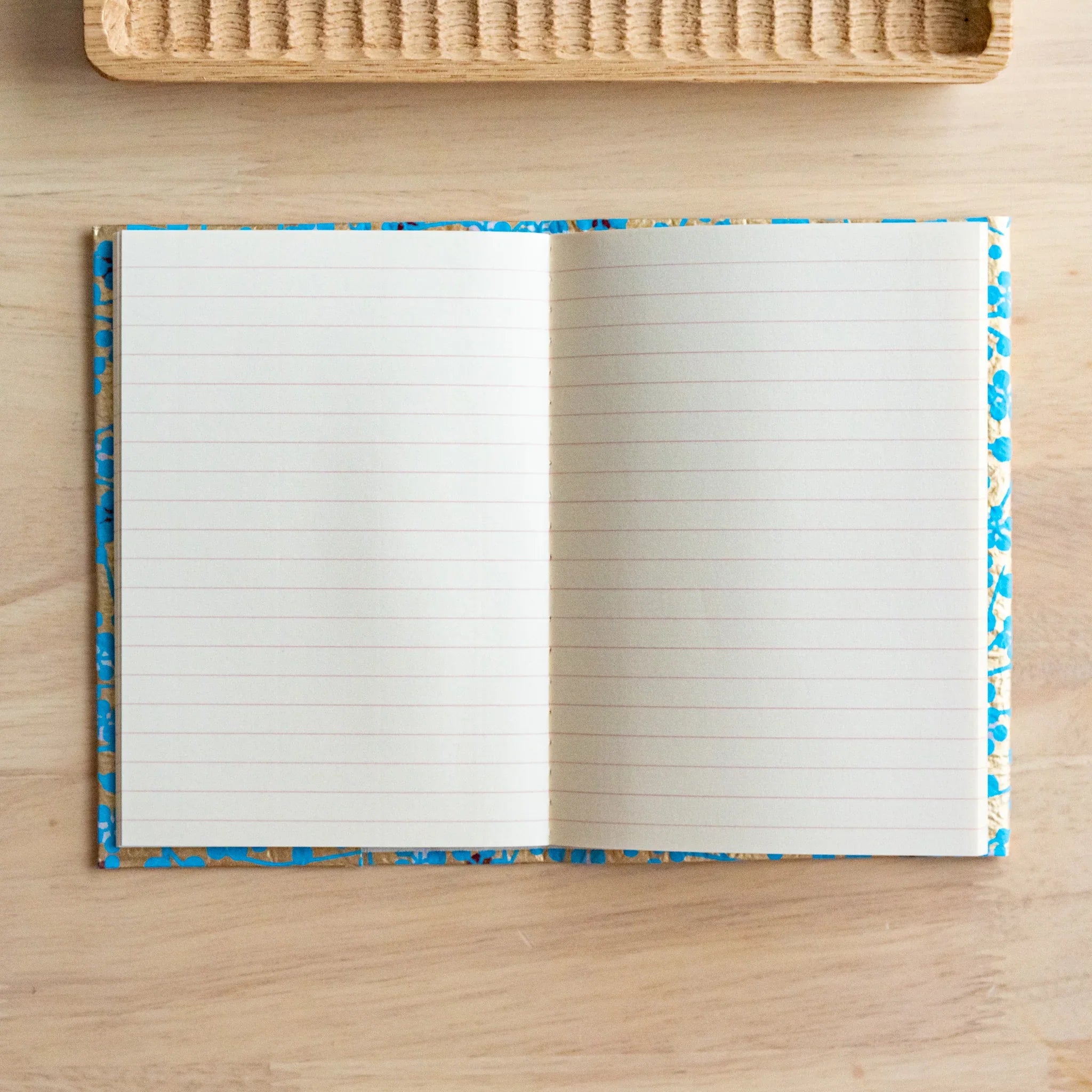 Hand-dyed blue flower washi paper unfolded showing full decorative pattern for A6 size book protection