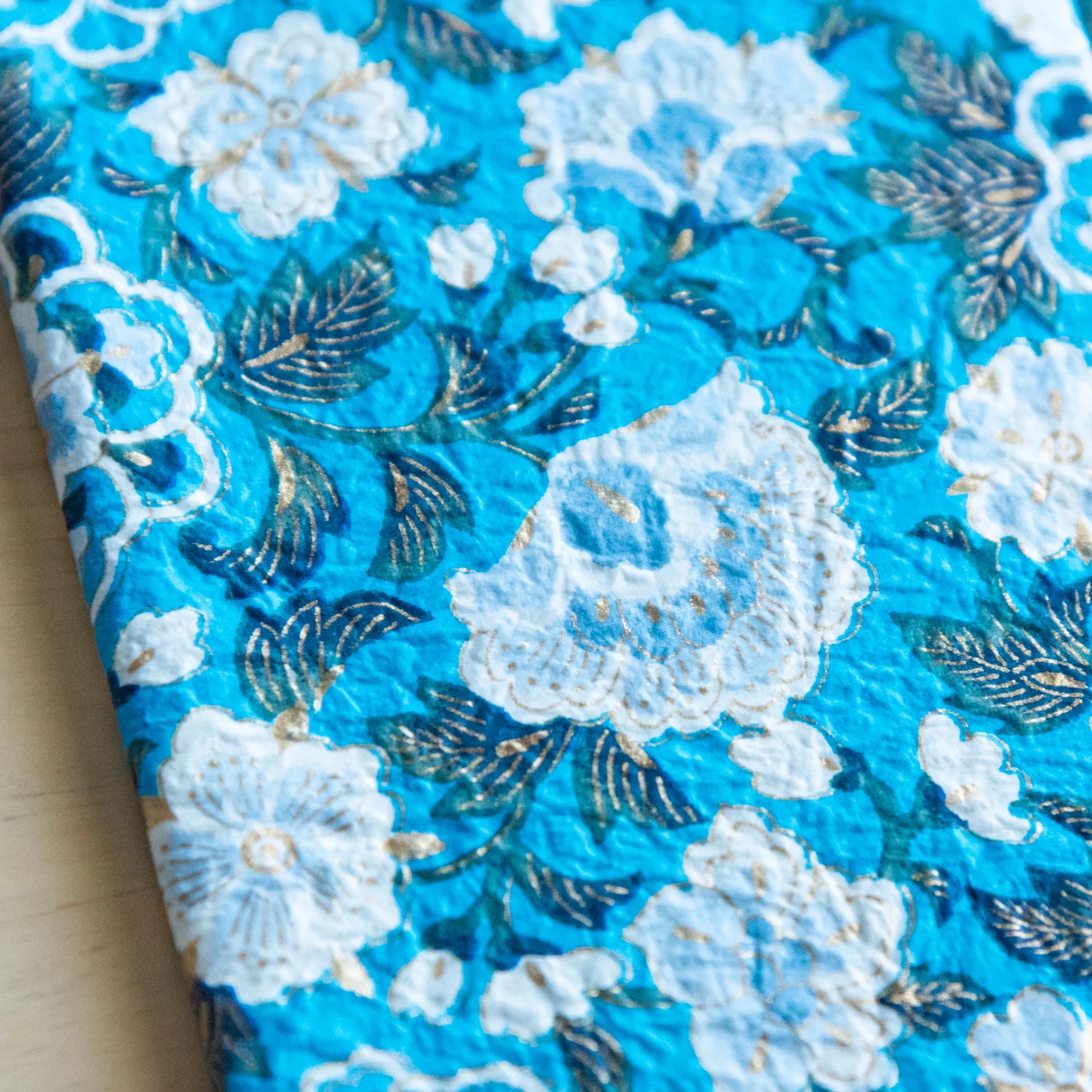 Blue garden hand-dyed yuzen washi book cover A6, showing rich floral yuzen design with white and dark foliage hue