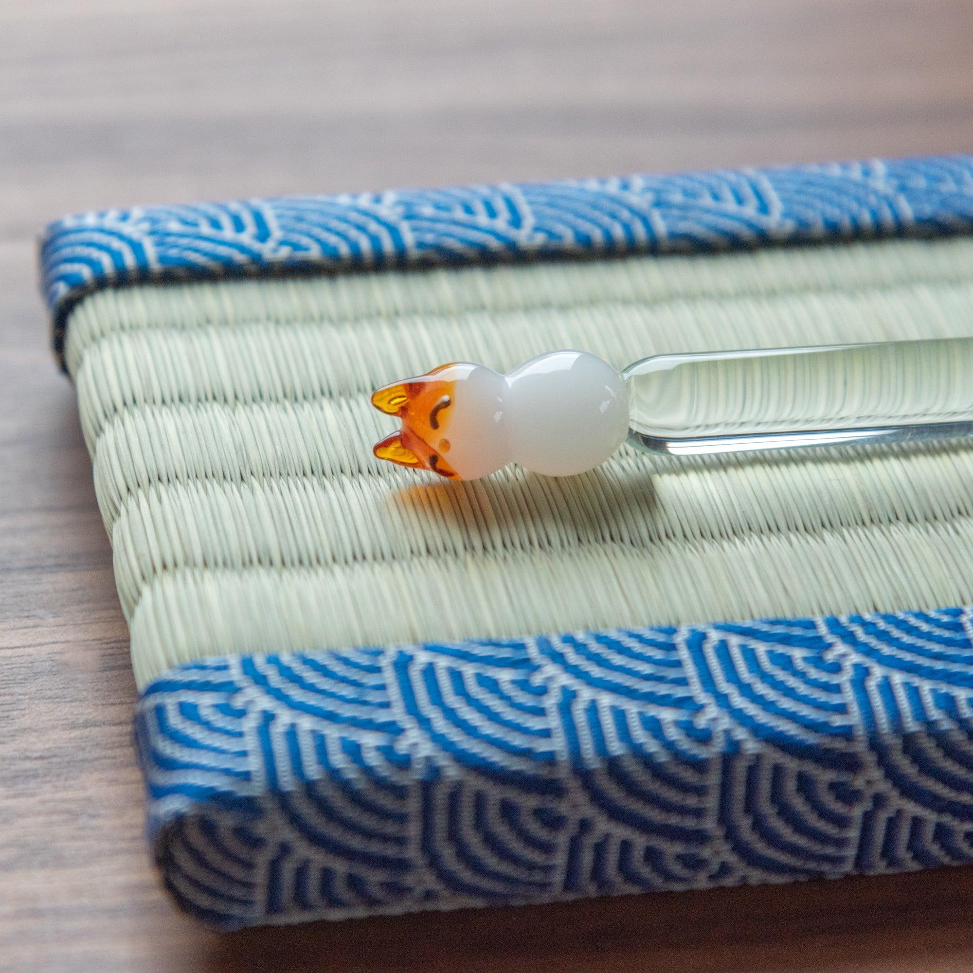 Flat lay of Blue Yachiyo pen tray on wooden desk with white notebook showing scale and usage showing product quality and d