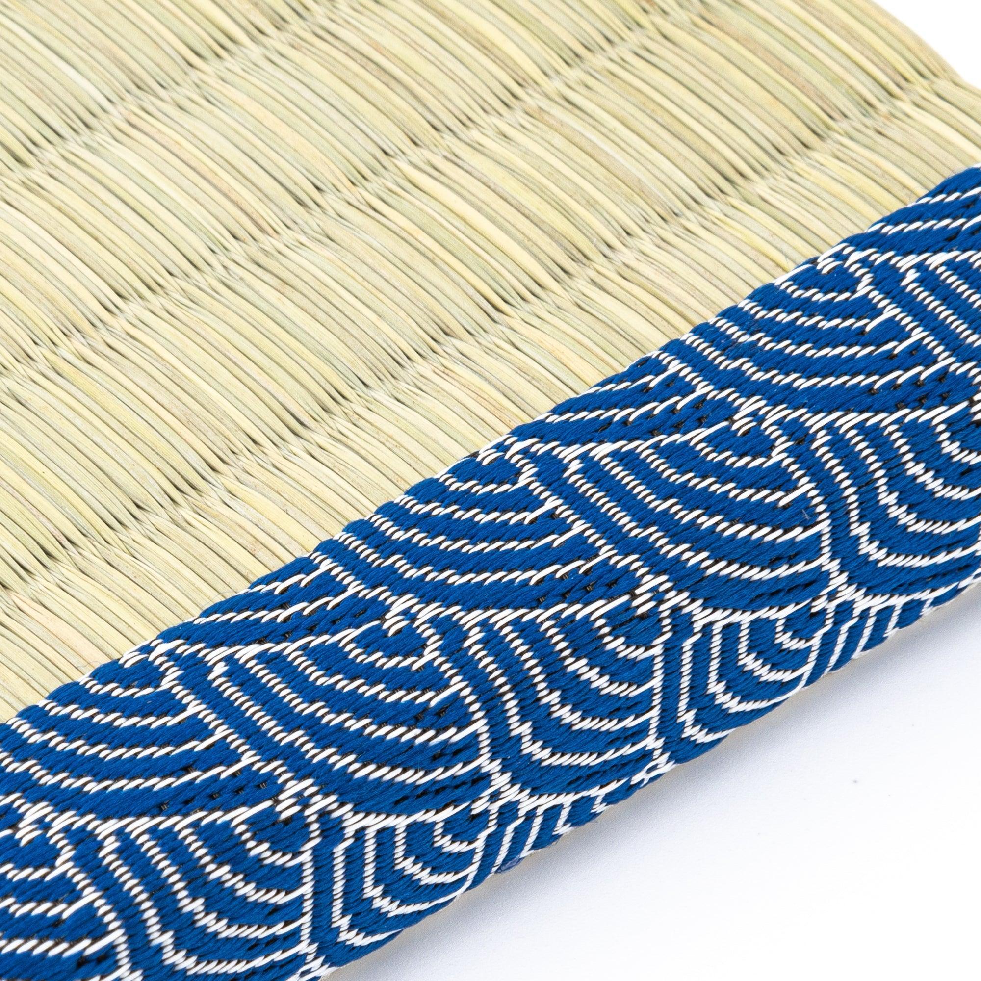 Blue Yachiyo tatami tray with two pens positioned lengthwise on woven grass surface showing product quality and design det