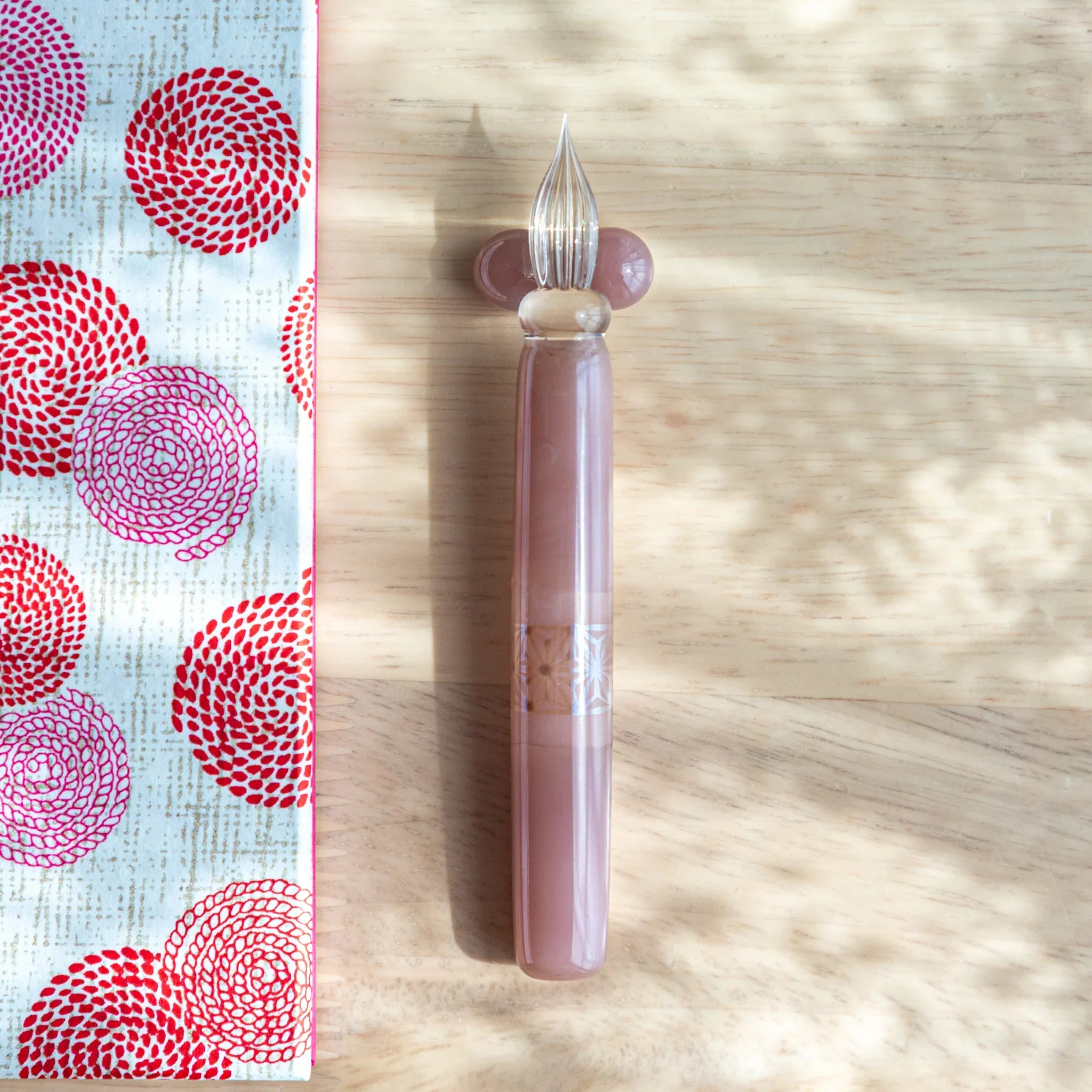 Blush pink hemp leaves glass dip pen detail showing soft feminine tone and traditional hemp leaf pattern