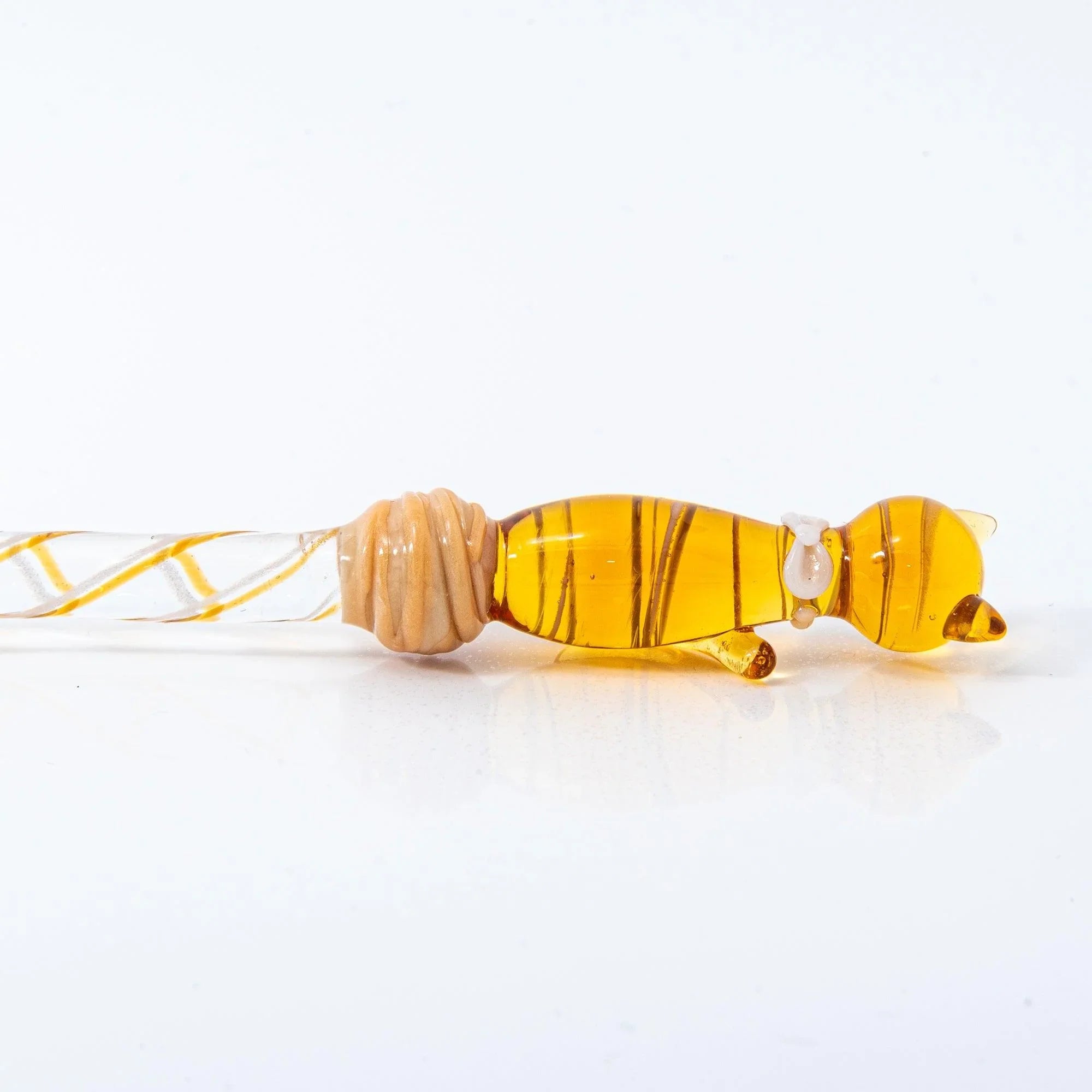 Brown Tabby Nyanko cat glass pen side view displaying clear glass nib and striped barrel design with handle detail and