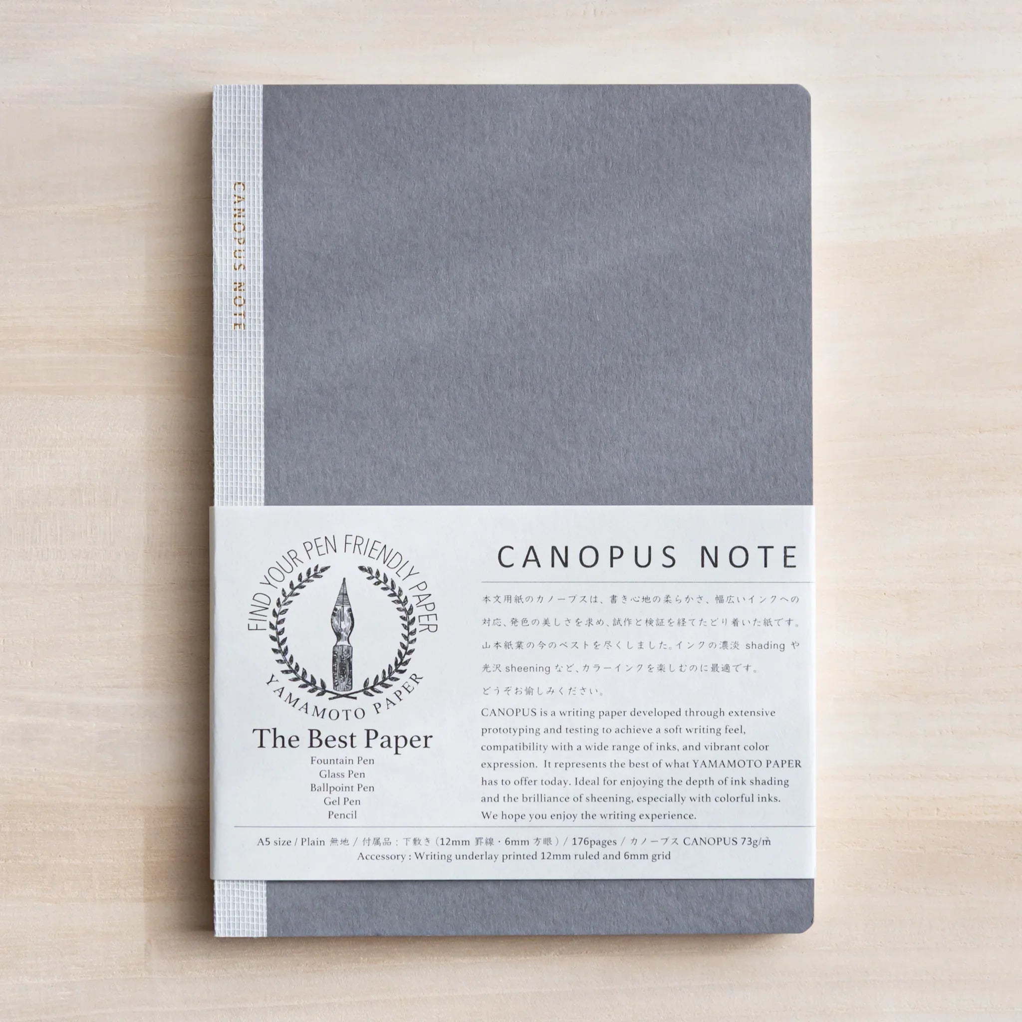 CANOPUS A5 notebook with gray cover and white binding showing product label and details showing product quality and design