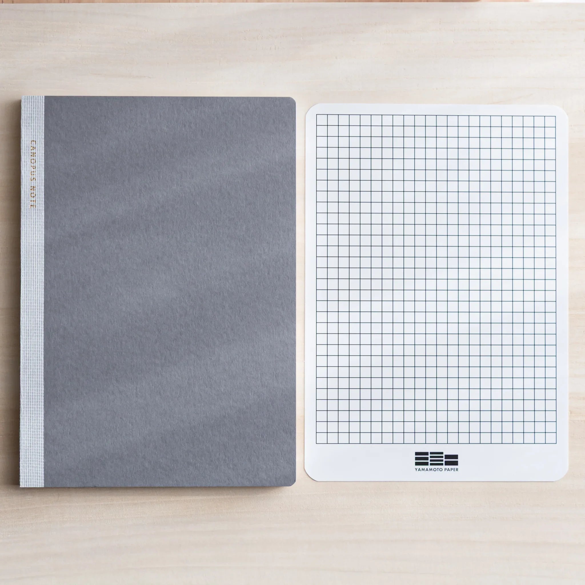 CANOPUS notebook pages fanned showing quantity and paper type clarity showing product quality and design details
