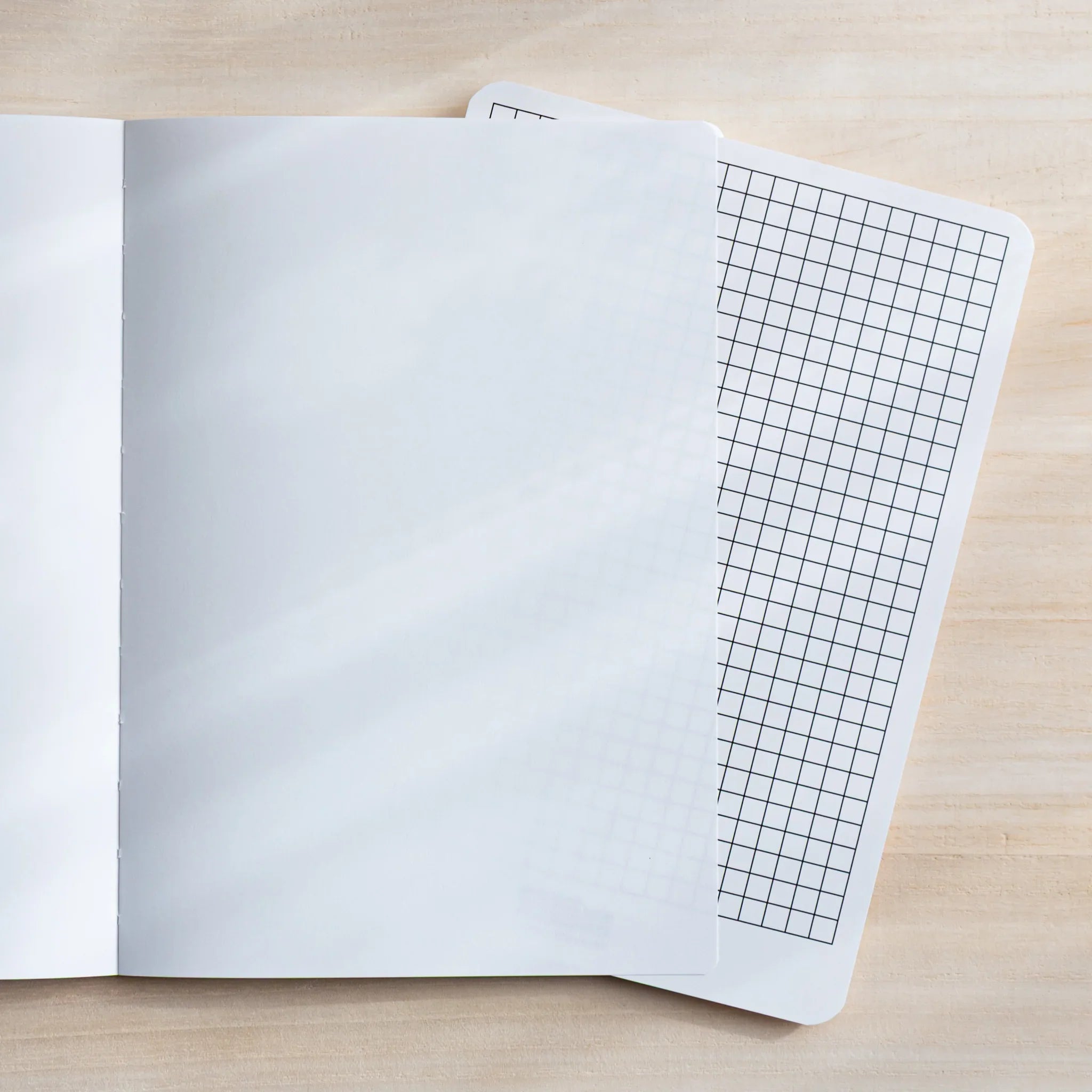 Gift presentation of CANOPUS notebook with coordinating Yamamoto paper products showing product quality and design details