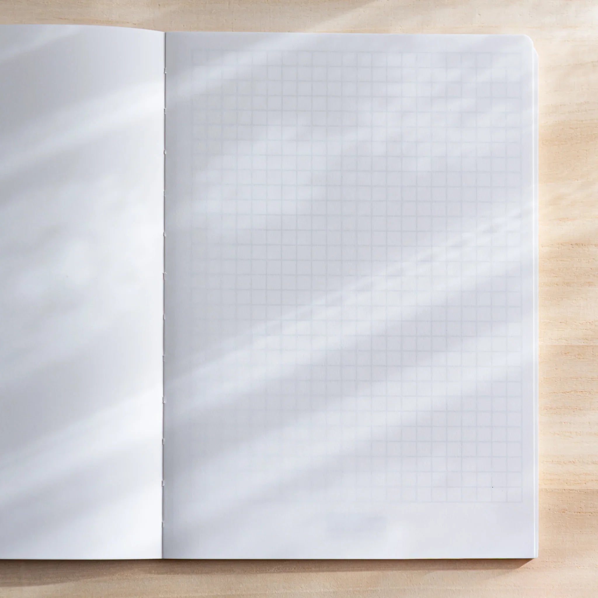 CANOPUS notebook with bookmark or ribbon marker visible in pages showing product quality and design details