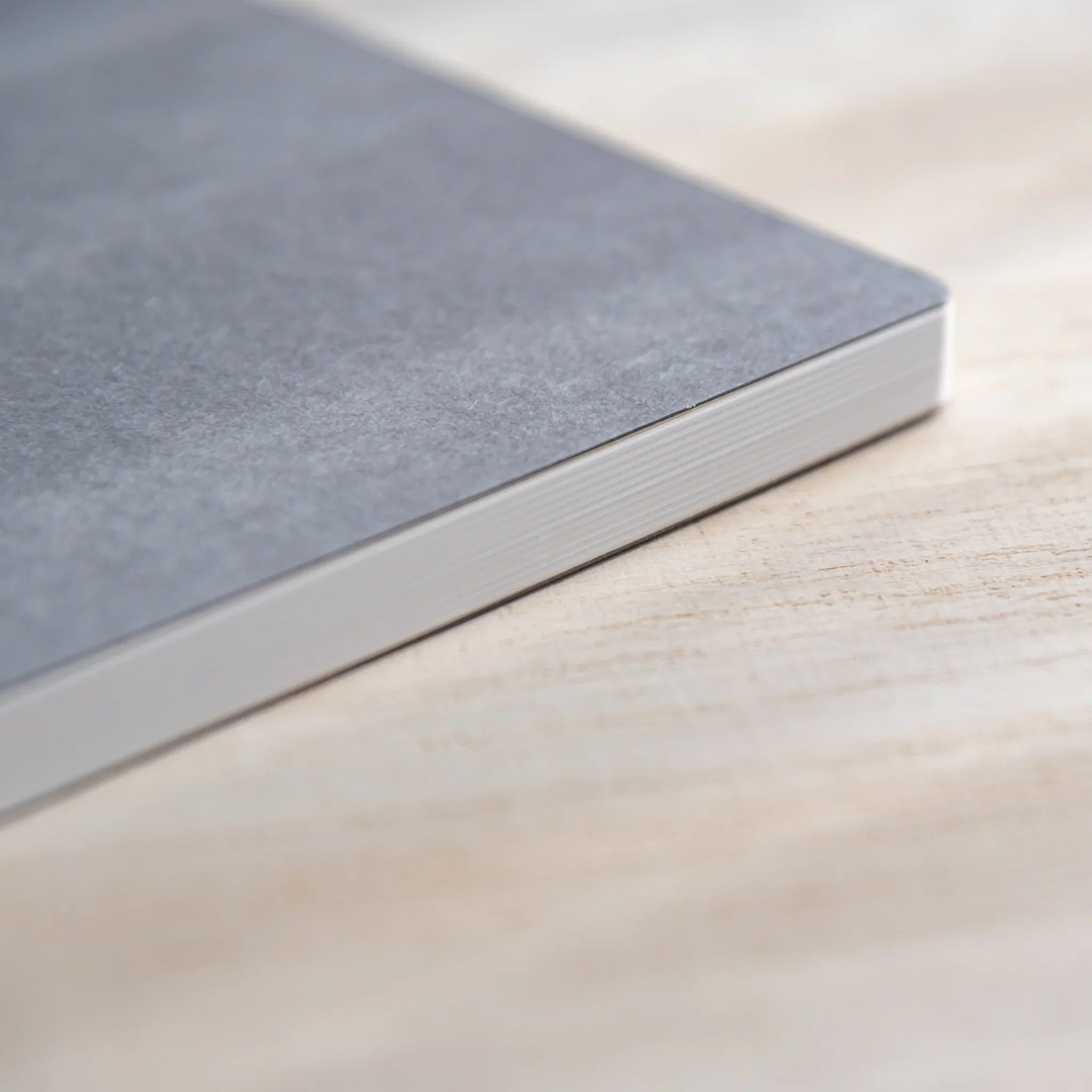 Stack of CANOPUS notebooks in different colors showing design range showing product quality and design details