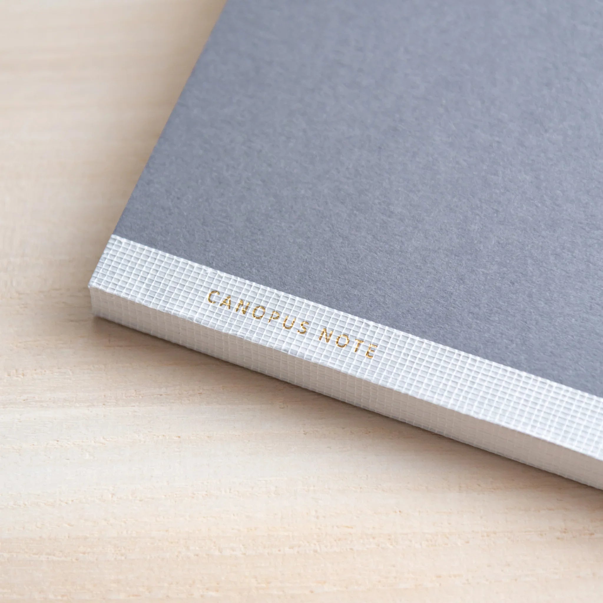 CANOPUS A5 notebook with various pens and pencils for creative work showing product quality and design details